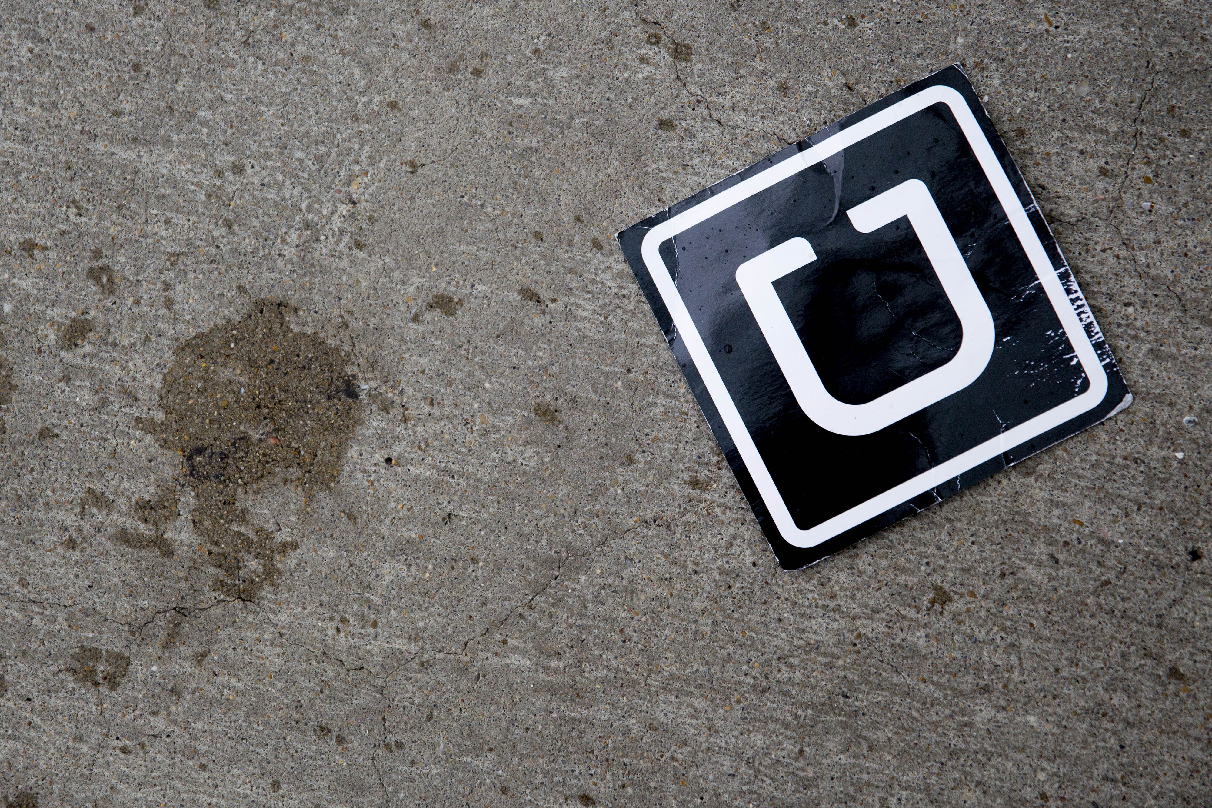 The Uber Technologies Inc. logo is seen on the ground at Ronald Reagan National Airport (DCA) in Washington, D.C. on Nov. 26, 2014. (Andrew Harrer—Bloomberg/Getty Images)