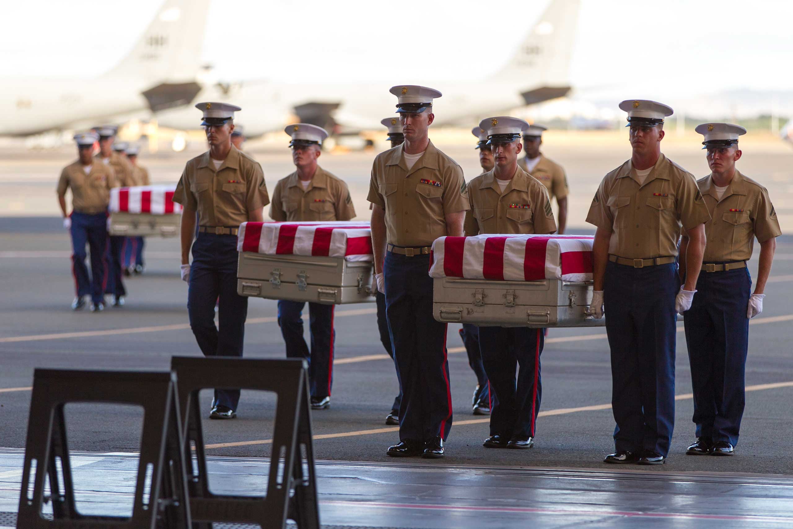 U.S. Marines carry the remains of 36 unidentified Marines found at a World War II battlefield during a ceremony at Joint Base Pearl Harbor-Hickam, July 26, 2015, in Honolulu. (Marco Garcia—AP)