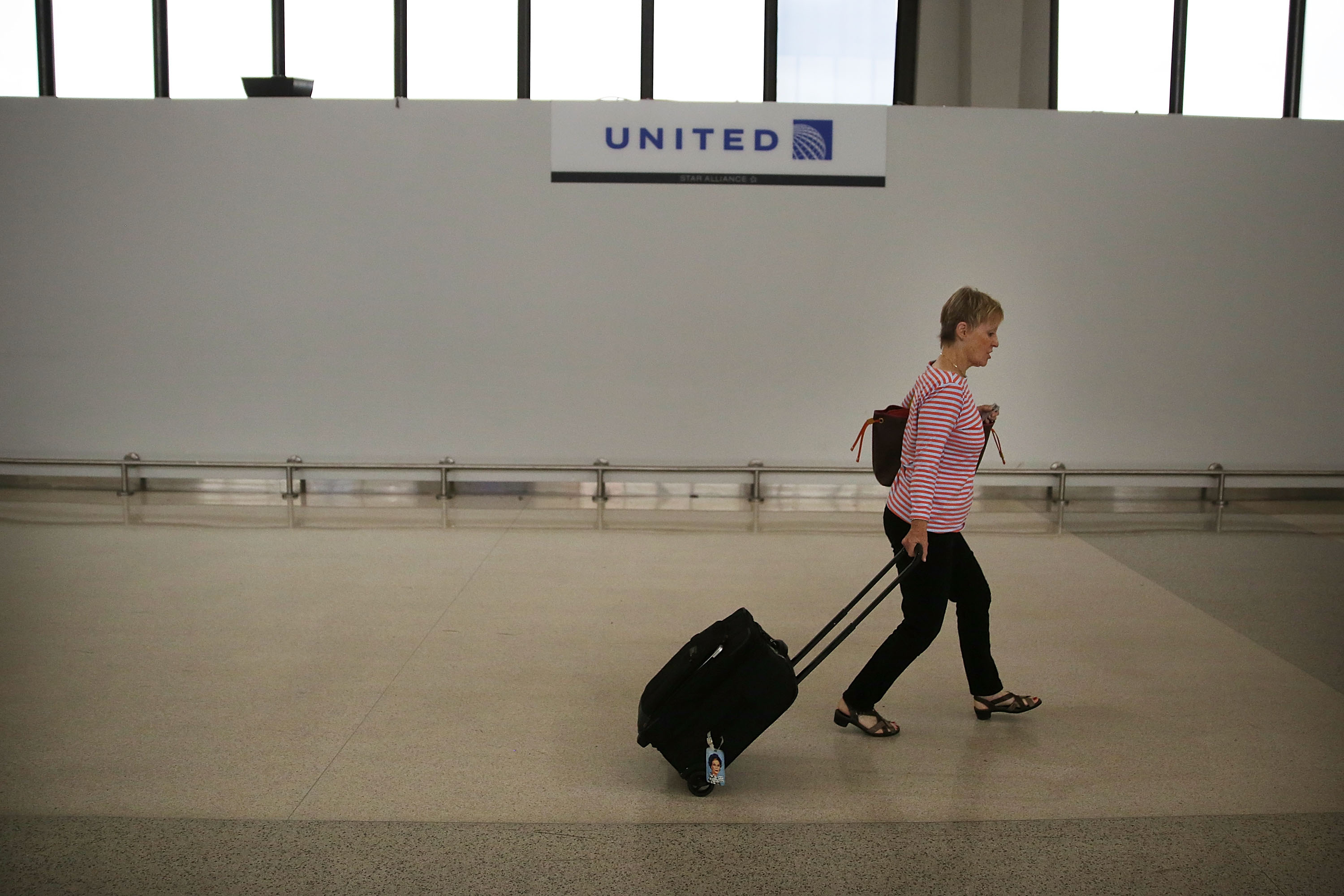 A traveler walks through the United Airlines terminal at Newark Liberty Airport on July 8, 2015 in Newark, New Jersey. (Spencer Platt—Getty Images)