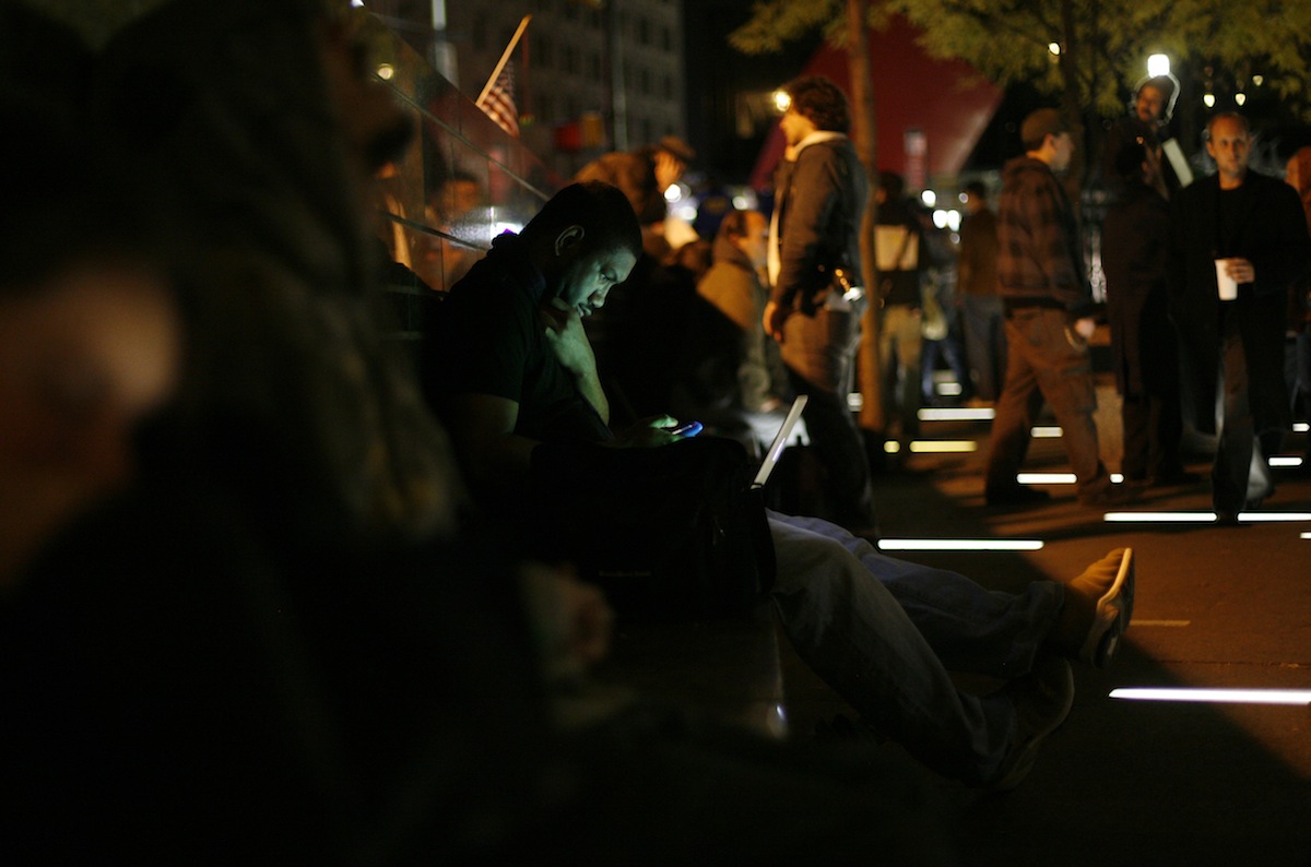 A man uses a computer at Zuccotti Park in lower Manhattan during Occupy Wall Street, Nov. 15, 2011. (Allison Joyce&mdash;Getty Images)