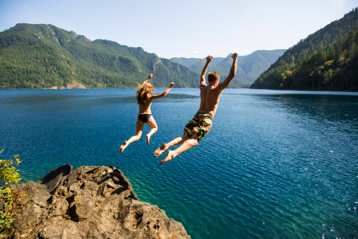 woman-man-jumping-off-cliff