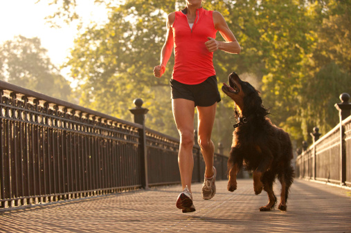 woman-running-with-dog