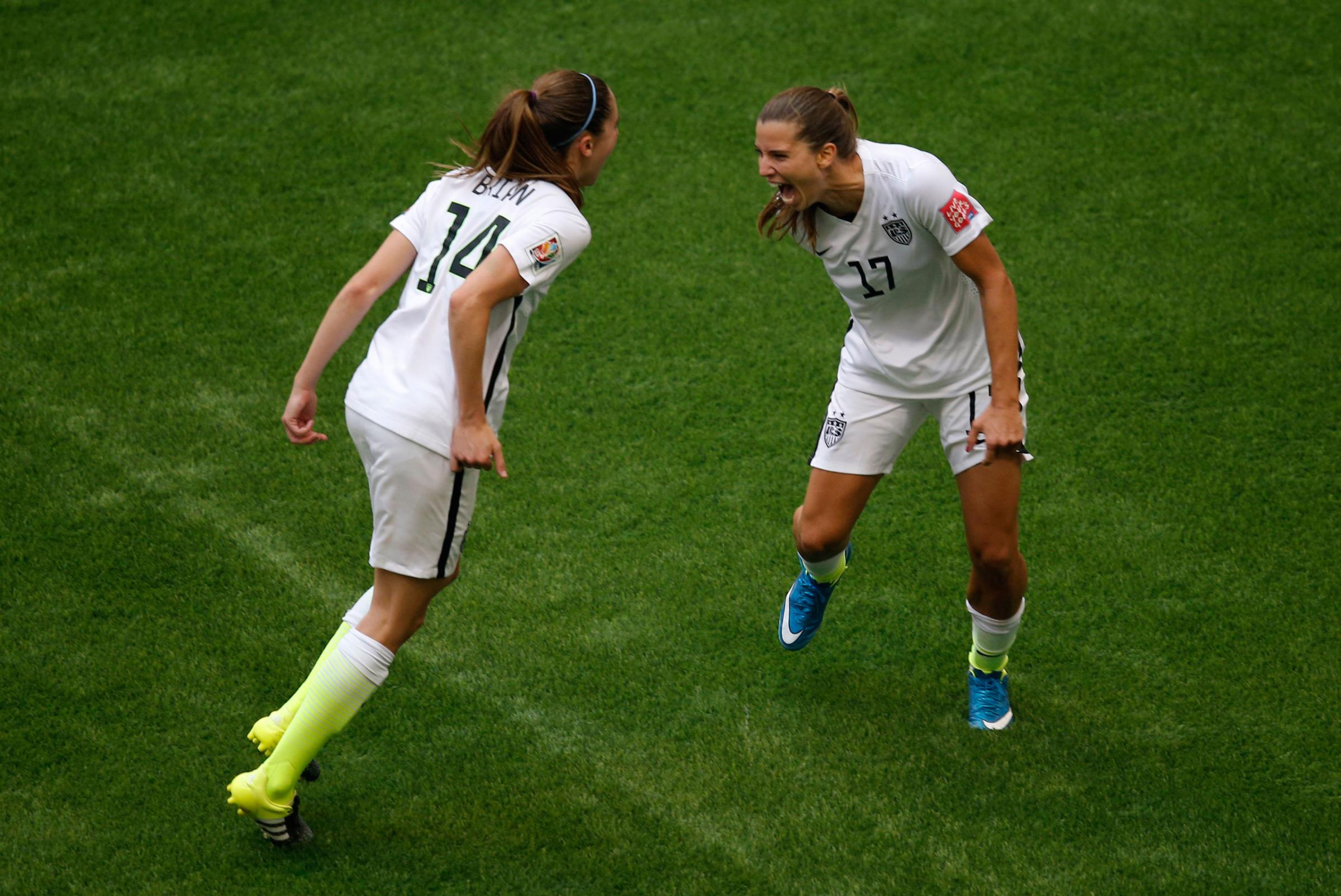 Jul 5, 2015; Vancouver, British Columbia, CAN; United States midfielder Tobin Heath (17) celebrates with midfielder Morgan Brian (14) after scoring against Japan during the second half of the final of the FIFA 2015 Women's World Cup at BC Place Stadium. Mandatory Credit: Erich Schlegel-USA TODAY Sports