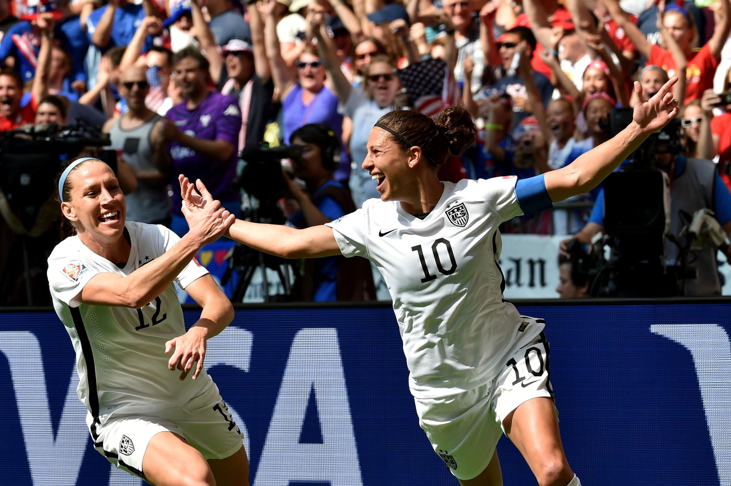 Lauren Holiday #12 and Carli Lloyd #10 of the United States celebrate with teammates after Lloyd scores her second goal against Japan in the FIFA Women's World Cup Canada 2015 Final at BC Place Stadium on July 5, 2015 in Vancouver, Canada. (Photo by Rich Lam/Getty Images)