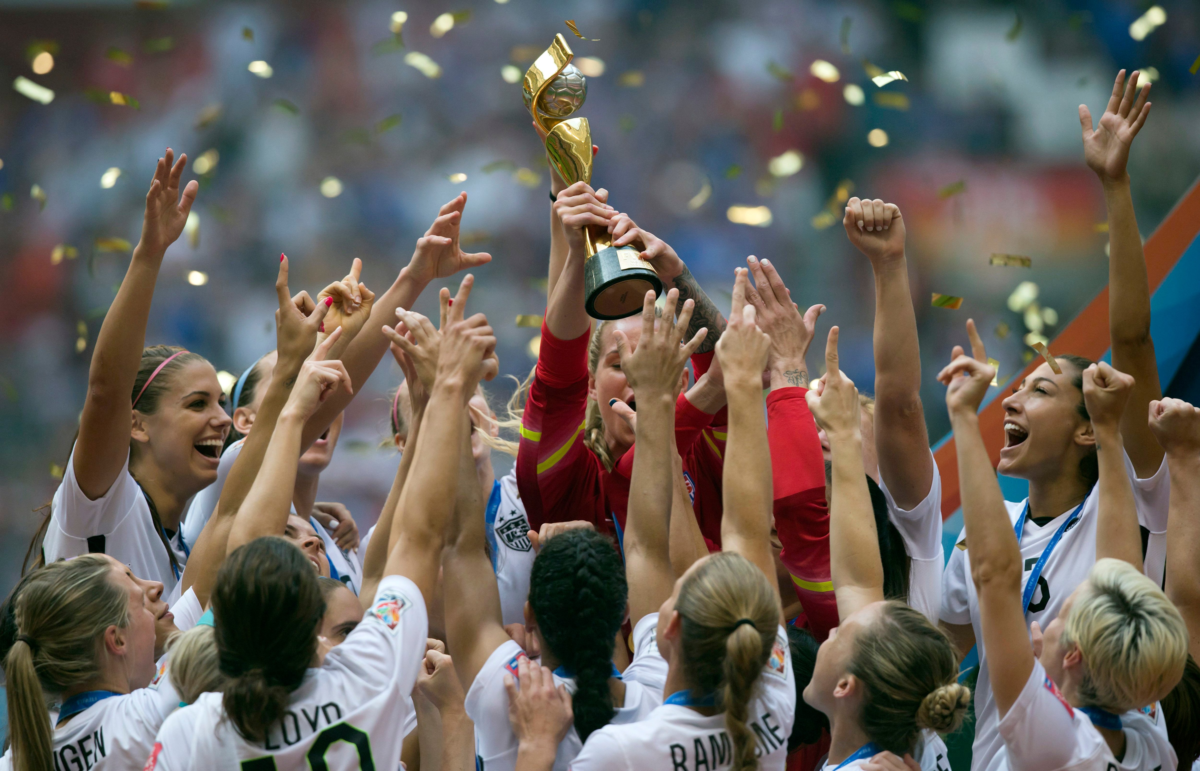 The U.S. Women's National Team celebrates with the trophy after they defeated Japan 5-2 in the FIFA Women's World Cup in Vancouver on July 5, 2015 (Darryl Dyck—AP)