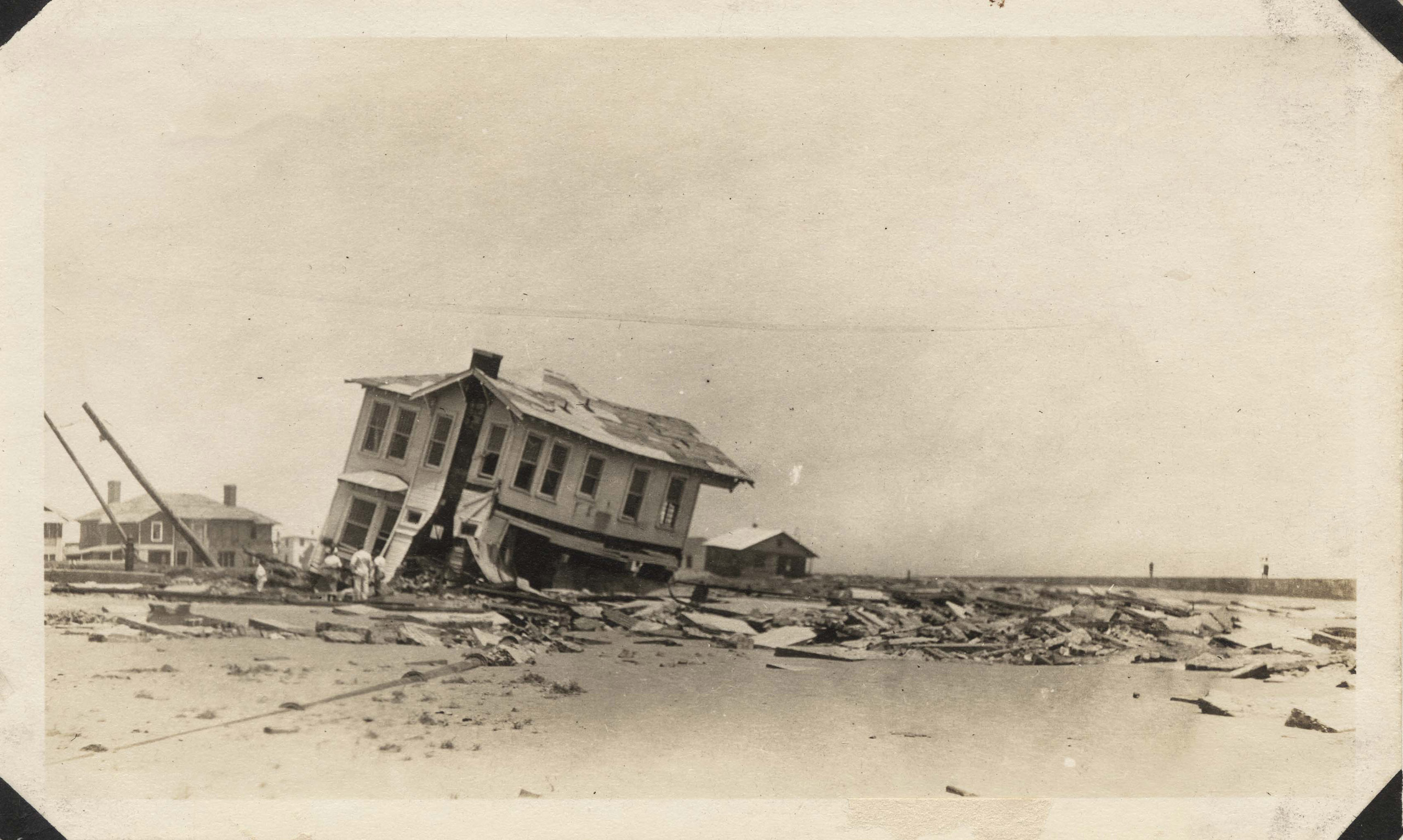 Wrecked houses on the east end of Galveston near Seawall Boulevard.
