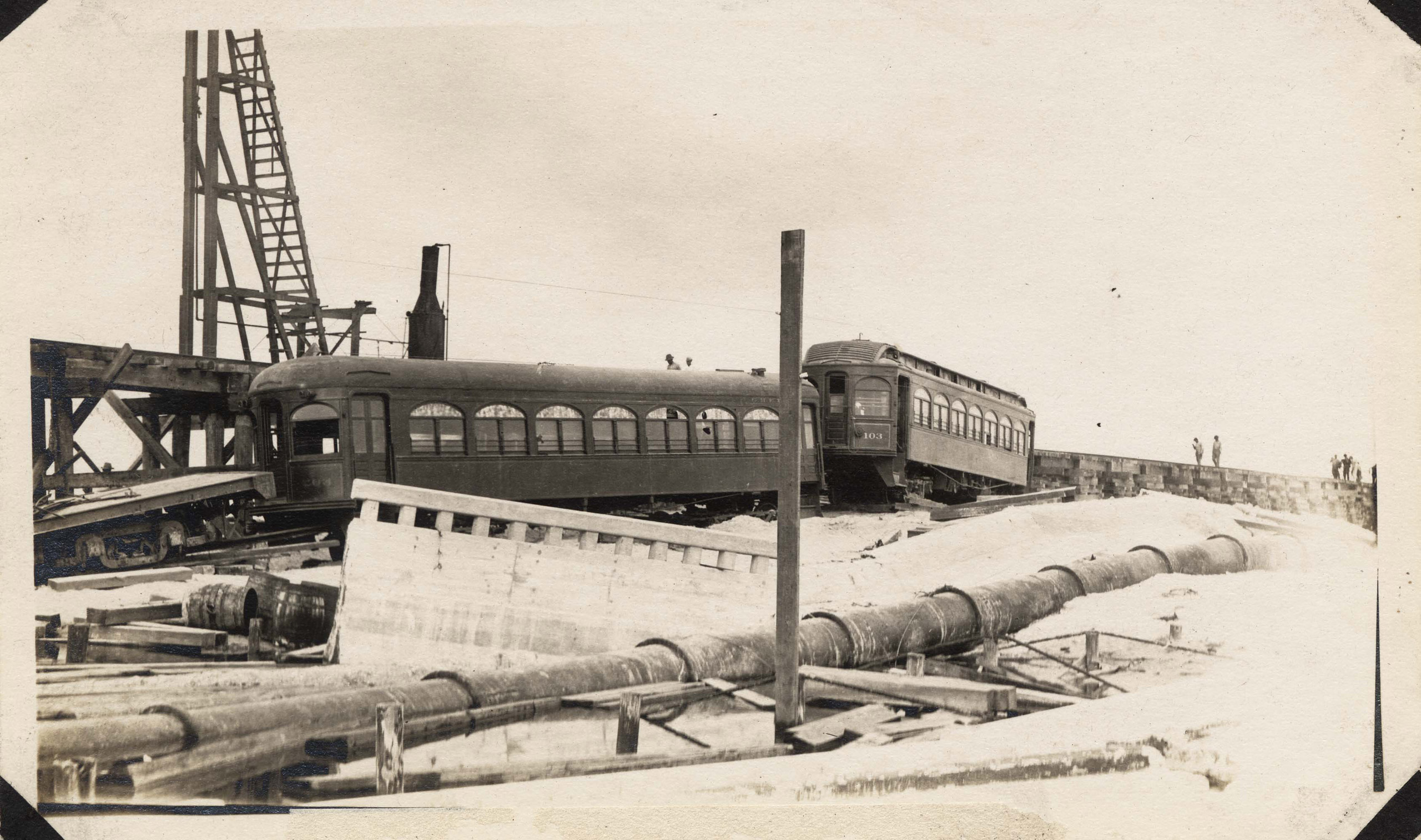 Interurban passenger cars that went down with the Causeway during the hurricane, after being righted and preparatory to lifting to the temporary trestle.