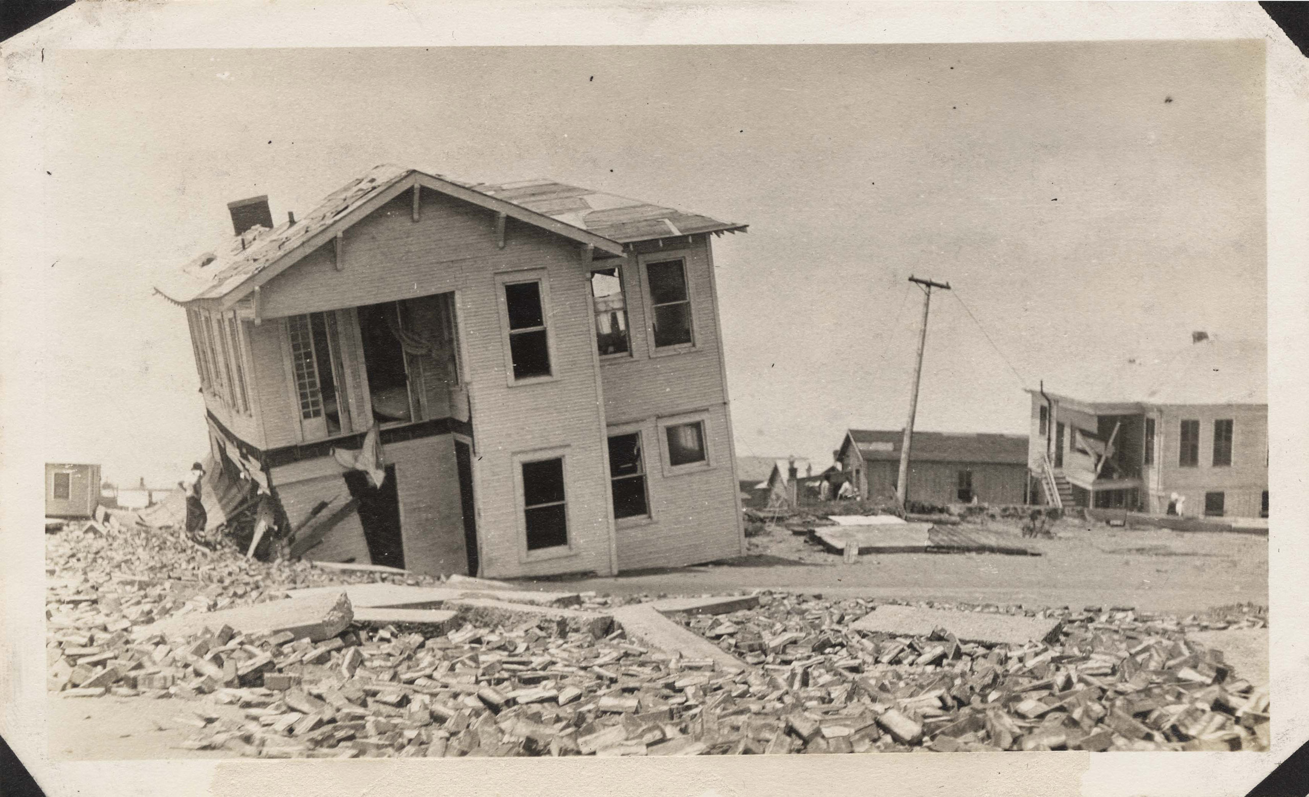 Wrecked houses on the east end of Galveston near Seawall Boulevard.