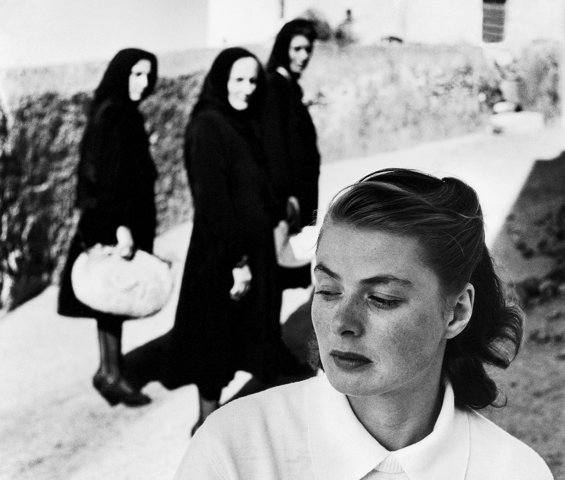 Ingrid Bergman attracts curiosity of local women in the village where she is on location for the film "Stromboli".