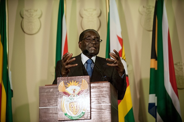 Zimbabwe's President Robert Mugabe delivers a speech along with South Africa's President before the signing of various memorandum of understanding between the two countries at the Union Buildings in Pretoria on April 8, 2015 (Stefan Heunis —AFP/Getty Images)