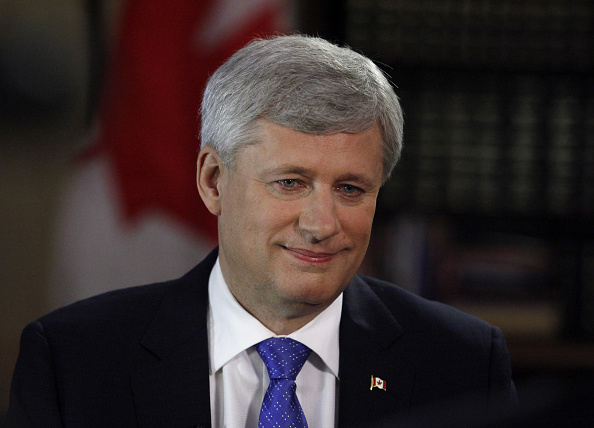 Stephen Harper, Canada's prime minister, smiles after a Bloomberg Television interview in Ottawa, Ontario, Canada, on July 29, 2015 (Patrick Doyle—Bloomberg Finance LP via Getty Images)