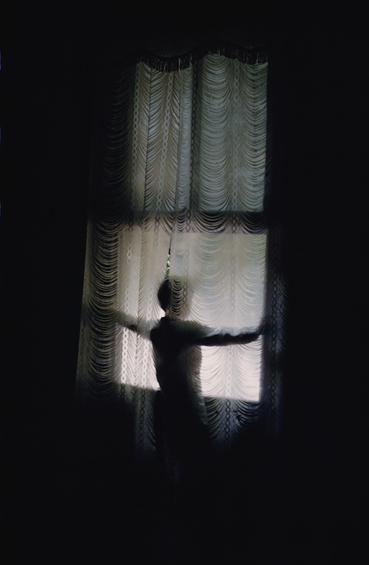 A figure stands looking out of a window at Agee House, home of the writer James Agee in Knoxville, Tenn., in 1962. (Ernst Haas&mdash;Getty Images)