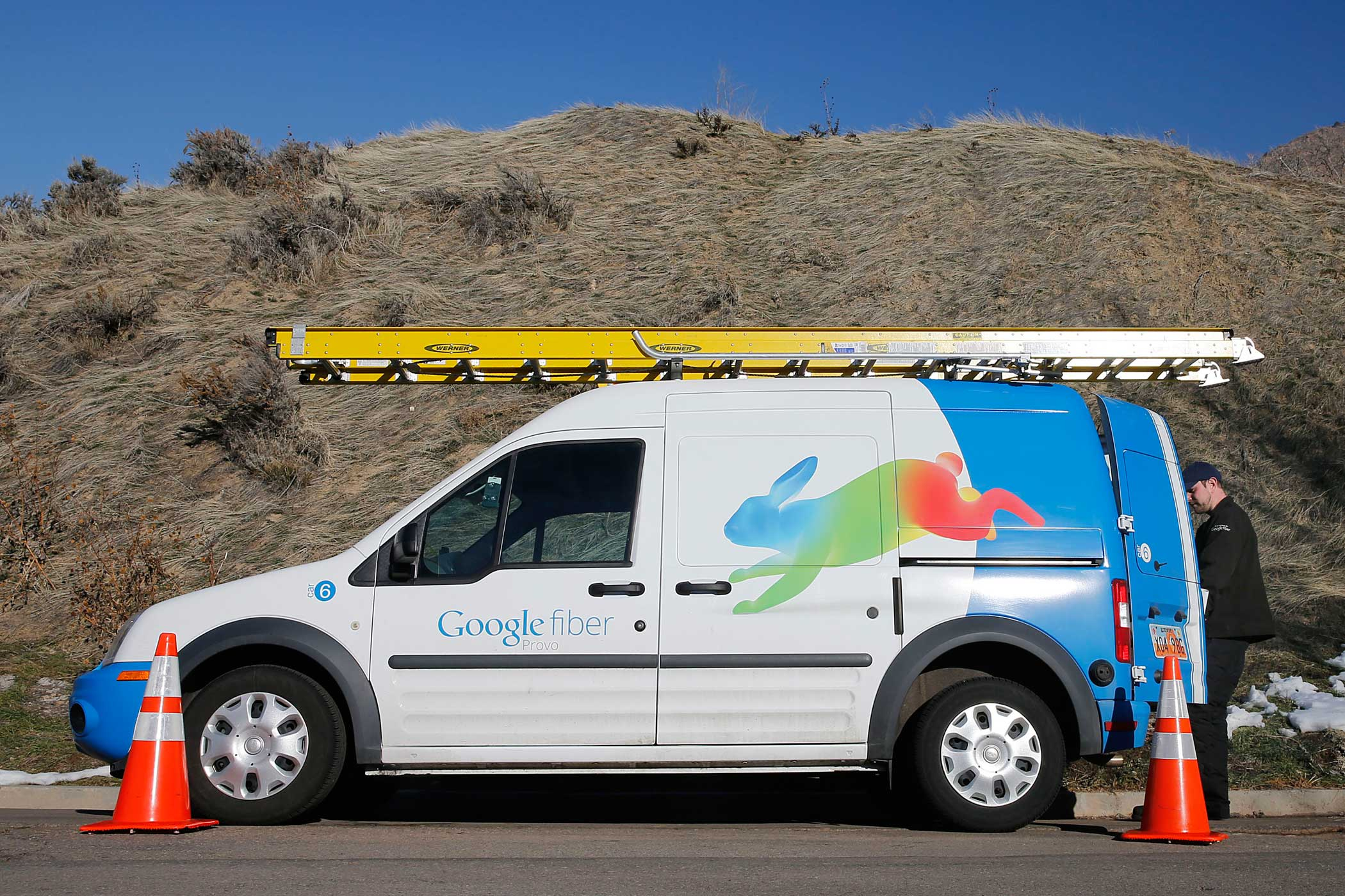 A Google Fiber technician gets supplies out of his truck to install Google Fiber in a residential home in Provo, Utah, January 2, 2014. Provo is one of three cities Google is currently building and installing gigabit internet and television service for business and residential use.