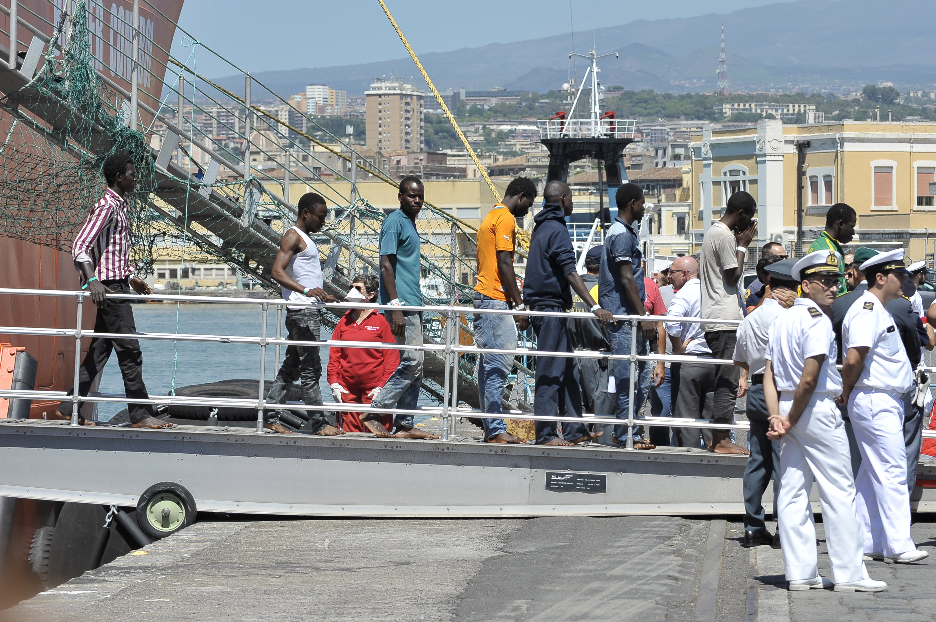Migrants disembark from the Norwegian ship Siem Pilot at Catania harbor, Italy, Monday, Aug. 17, 2015 (Carmelo Imbesi—AP)