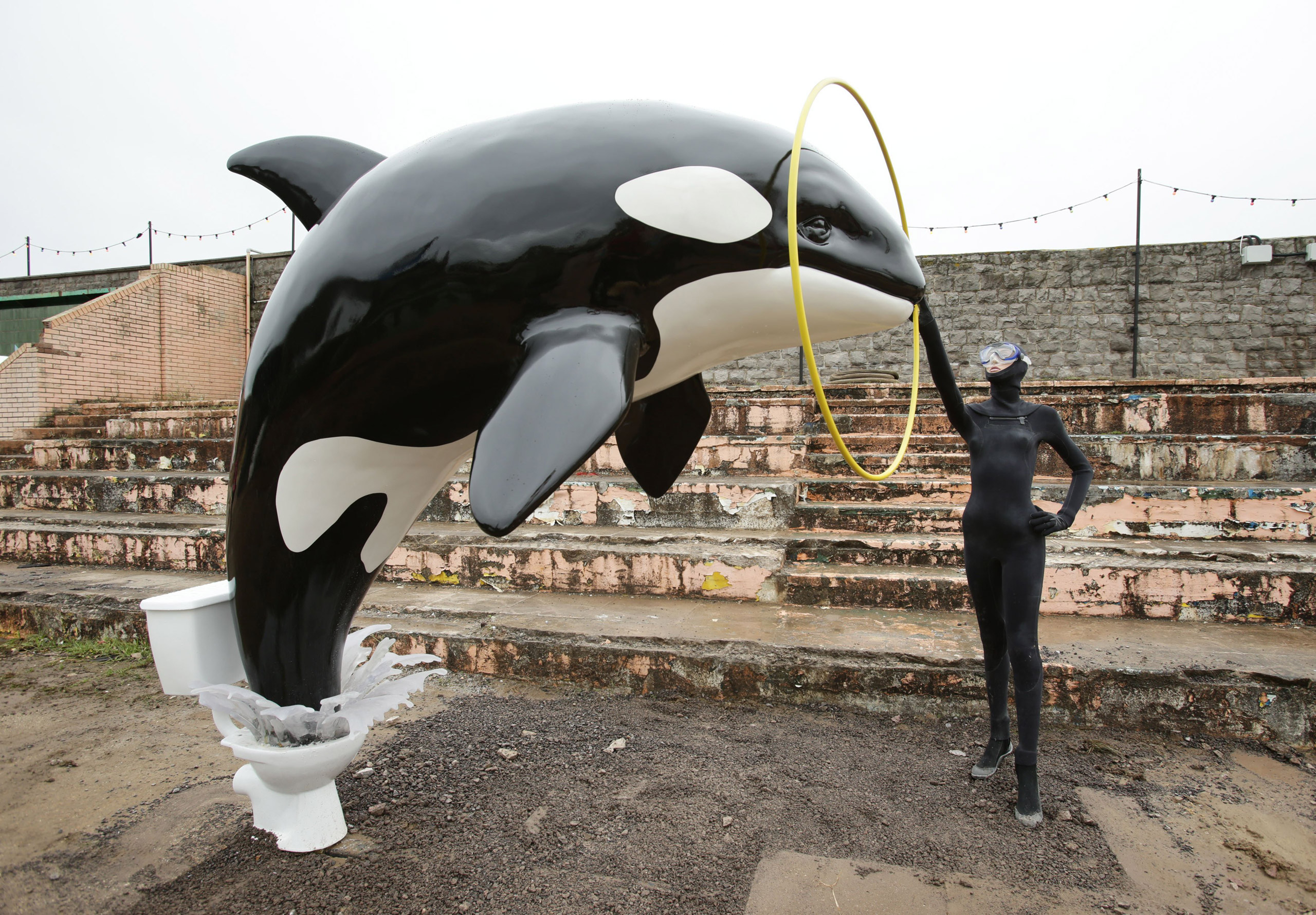 A sculpture of a killer whale jumping out of a toilet by Banksy.