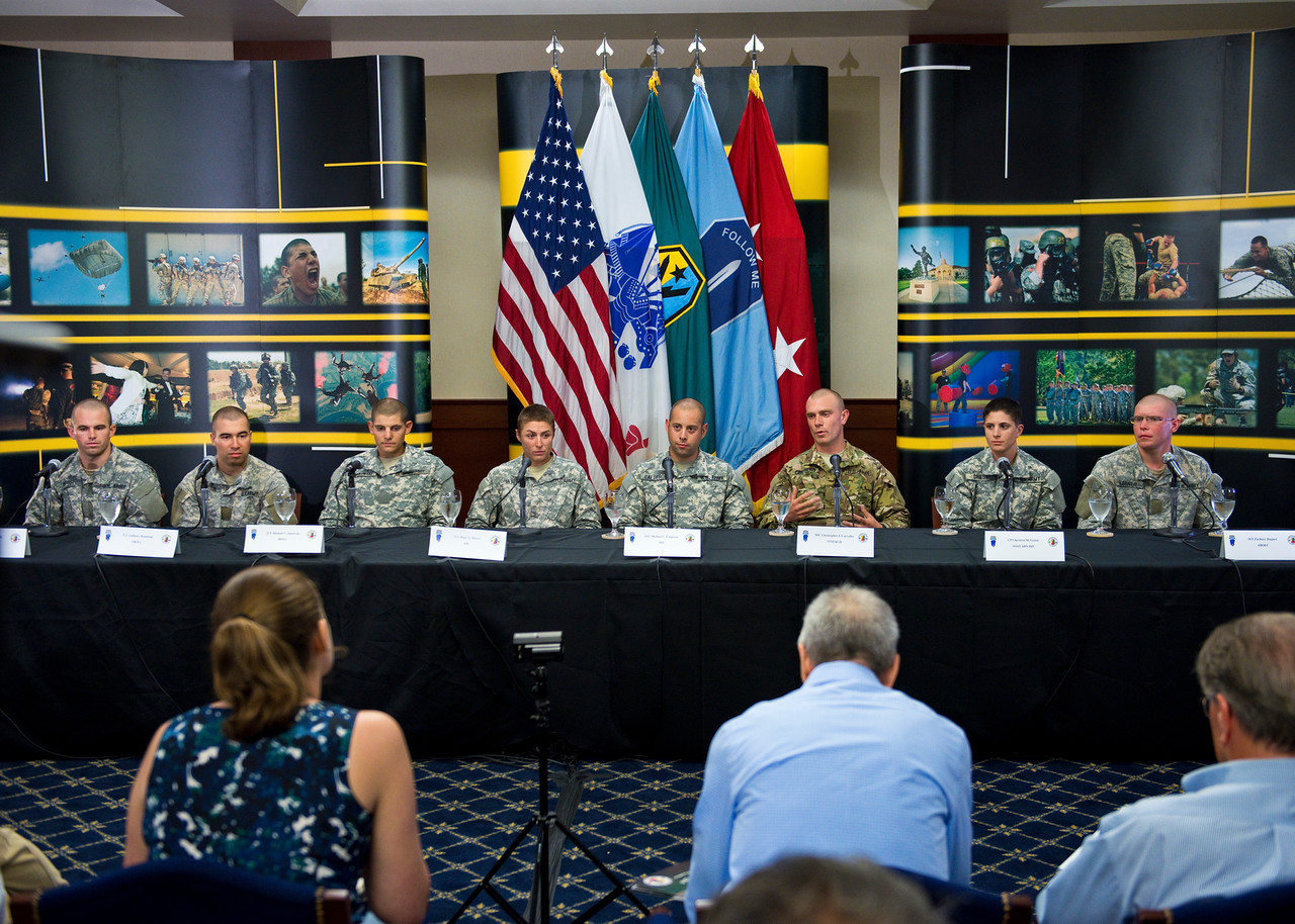 Captain Shaye Haver (4th from left) and 1st Lieutenant Kristen Griest (2nd from right) spoke of their Ranger School experience with six of their male comrades at Fort Benning on Thursday. (Army photo / Patrick A. Albright)