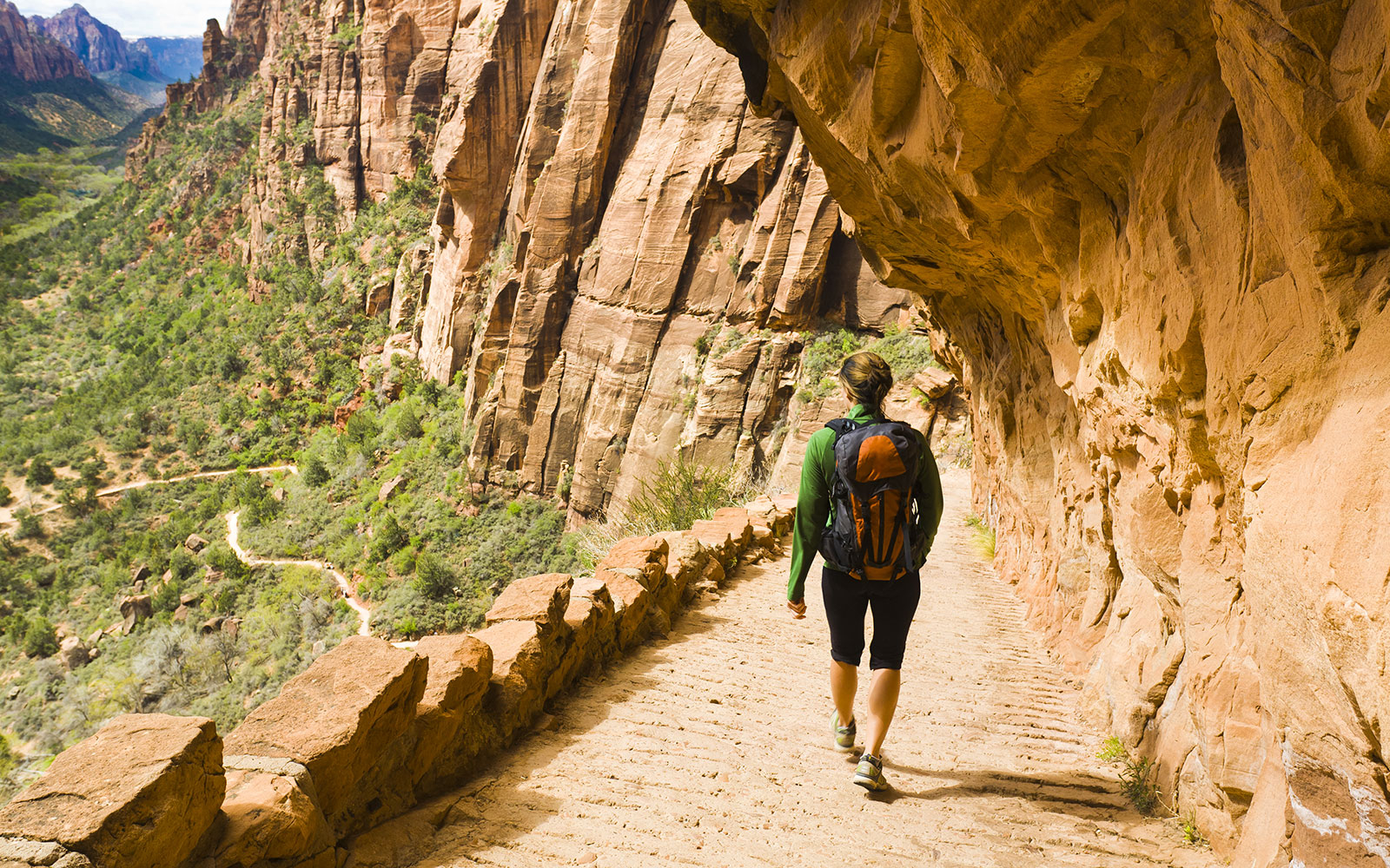 woman hiking on canyon path