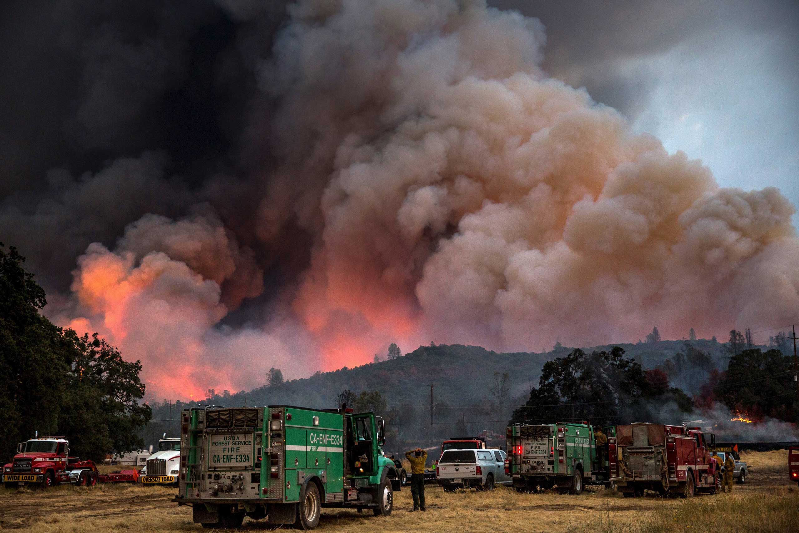 Firefighters watch the Rocky Fire advance in Lake County, Calif. on July 30, 2015.
