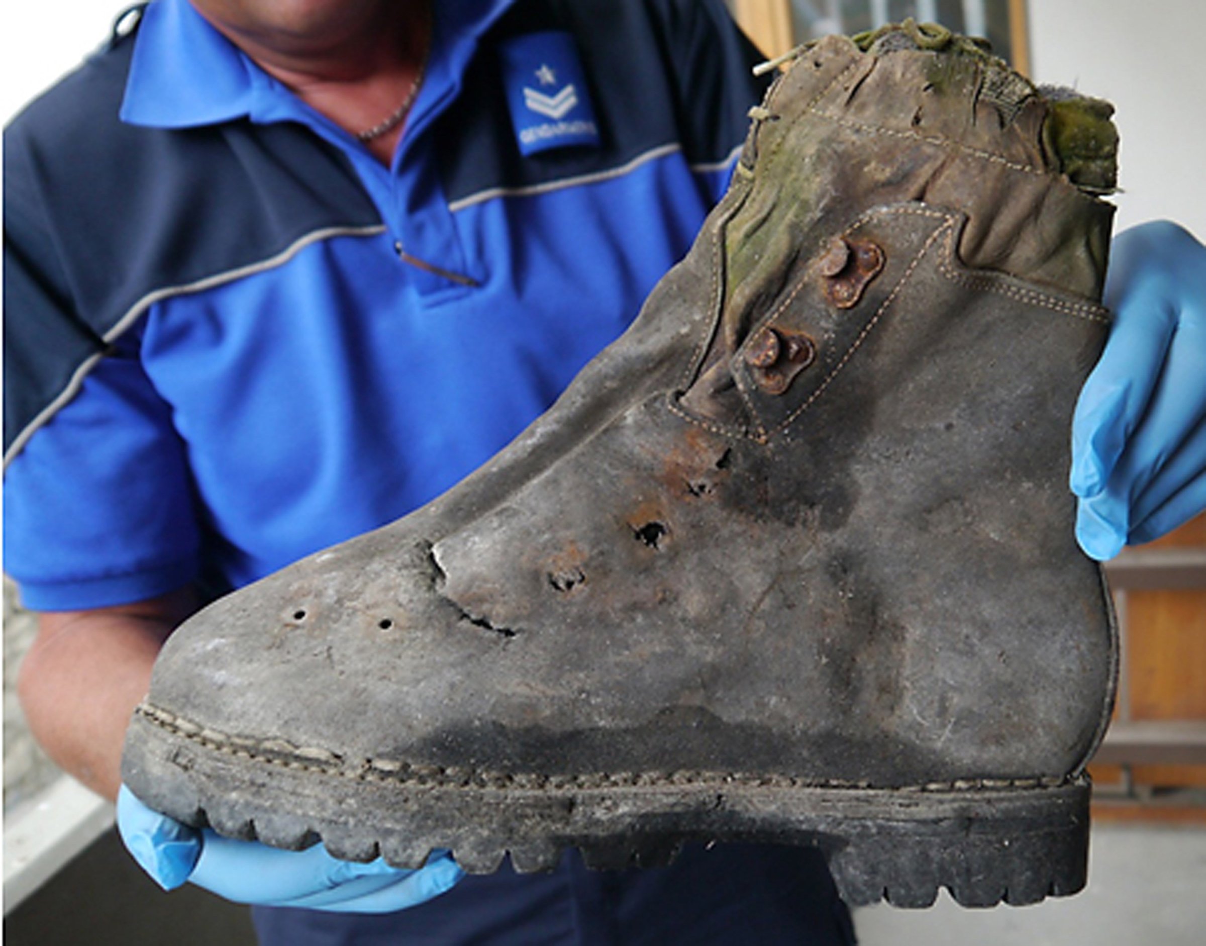 A mountain shoe found next to the remains of two Japanese climbers who disappeared in the Swiss Alps in 1970 on Aug. 6, 2015.