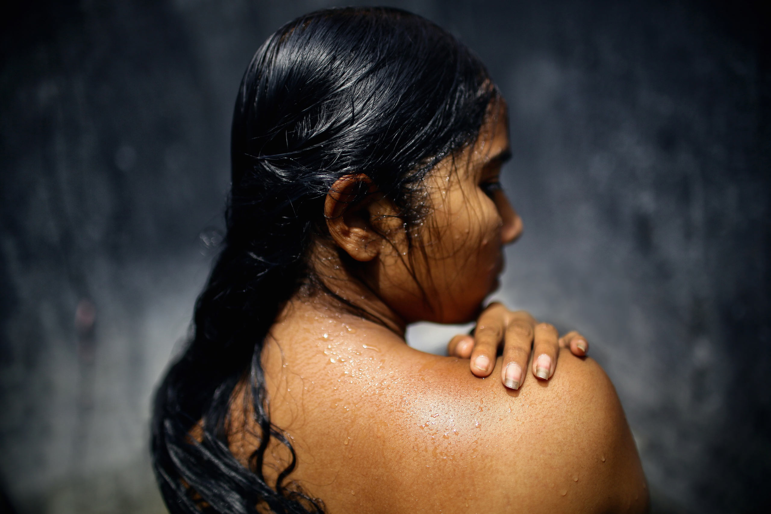 Beauty showers three times a day in between servicing clients. She is one of the underage minorities in the area, educated in the sexual health risks of working in Sonagachi, India. Nonetheless, she regularly attends four to five clients in between every shower.