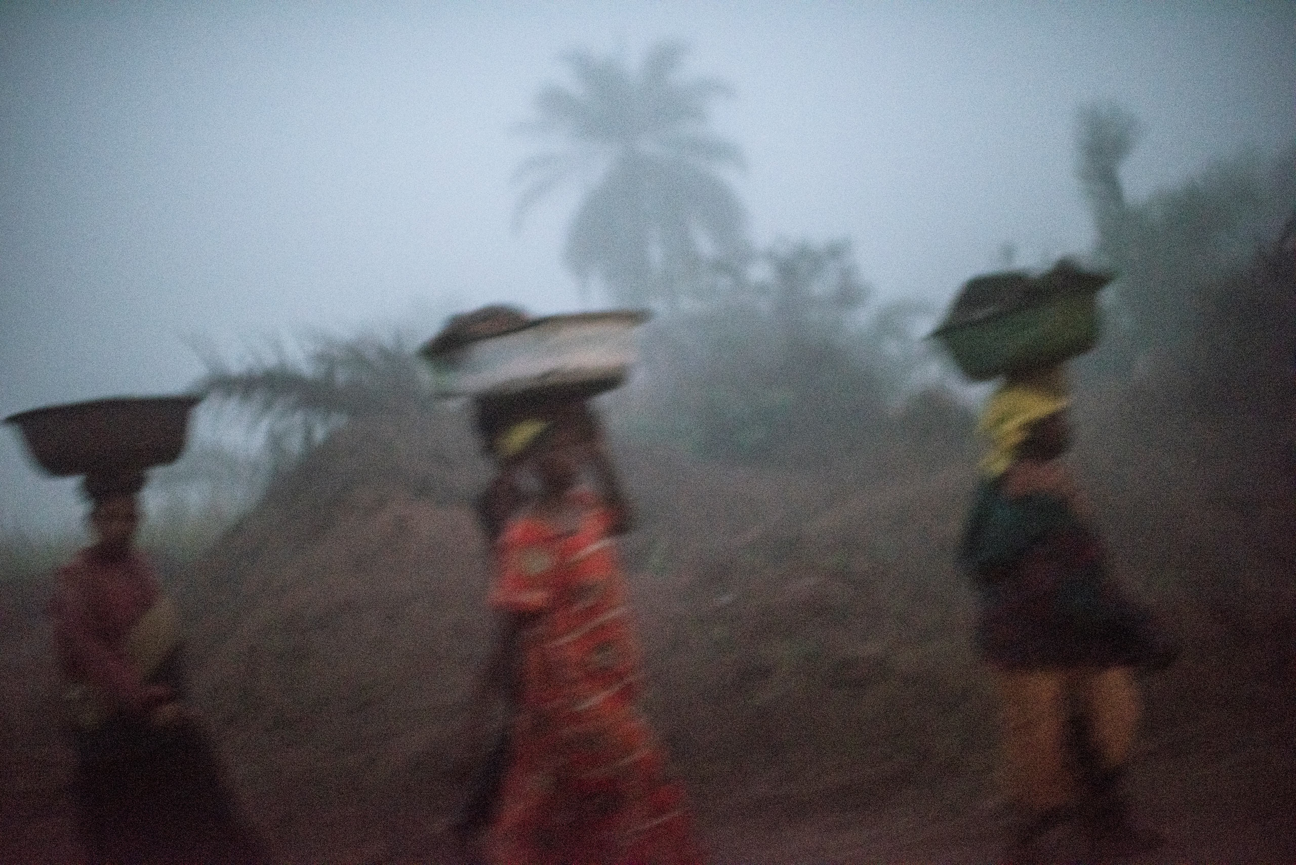 Women walk in the village of Lungudi, the center diamond mining in the southwest Democratic Republic of Congo. Aug. 7, 2015.