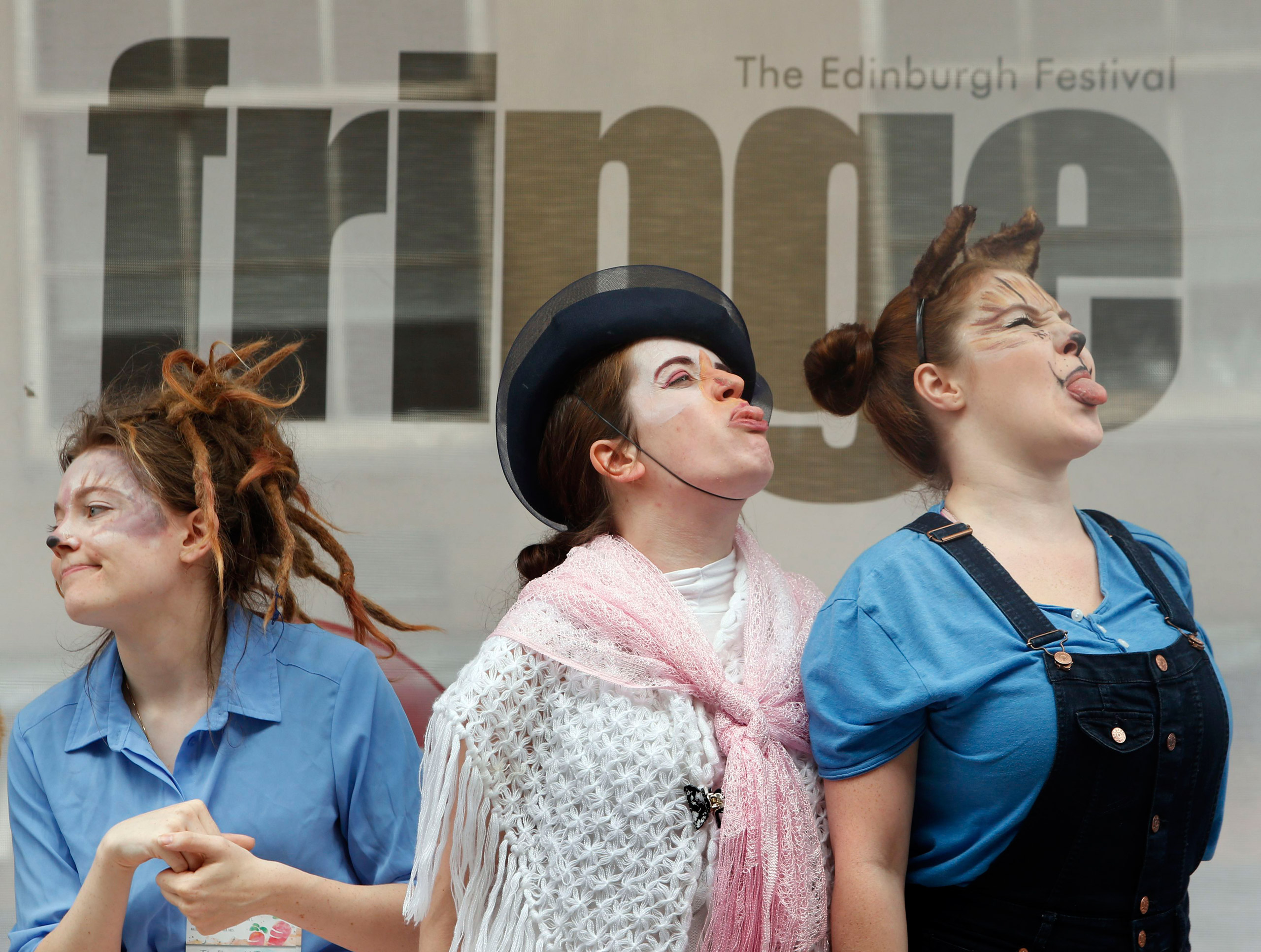 Edinburgh Fringe Festival 2015. Performers from The Emerald Theatre promote their Edinburgh Festival Fringe show on the Royal Mile in Edinburgh. Picture date: Monday August 24, 2015. The Edinburgh Festival Fringe is the largest arts festival in the world and takes place every August for three weeks in Scotland's capital city. Photo credit should read: Danny Lawson/PA Wire URN:23902956