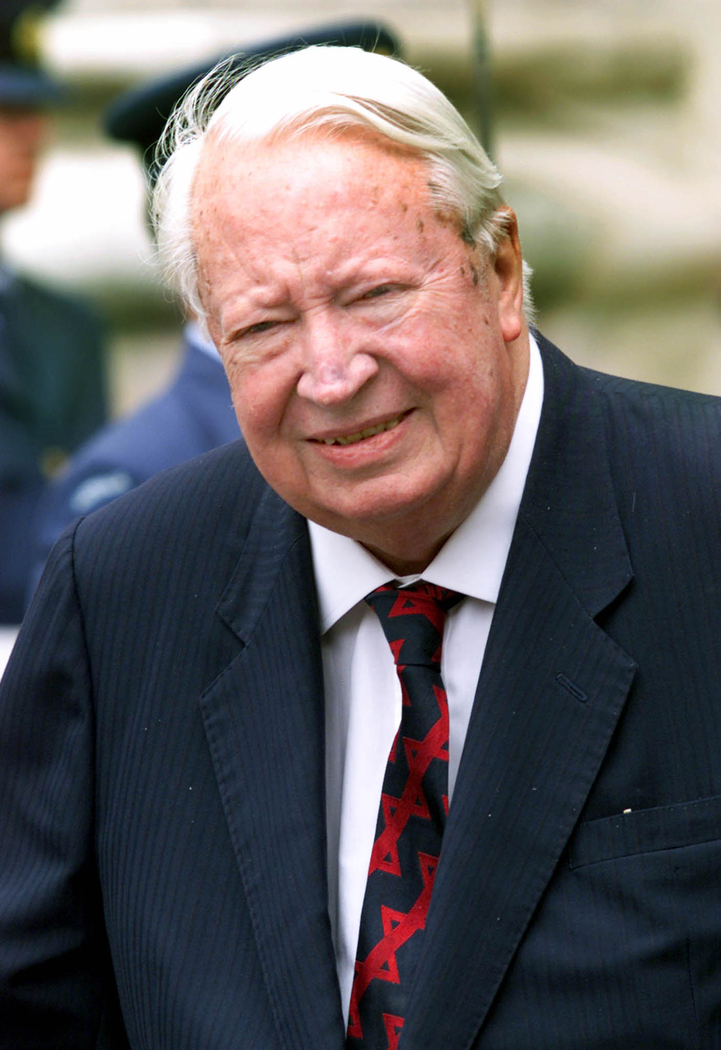 Edward Heath, former British Prime Minister, leaves Westminster Abbey after a service to mark the centenary of modern Australia on July 7, 2000. (Reuters)