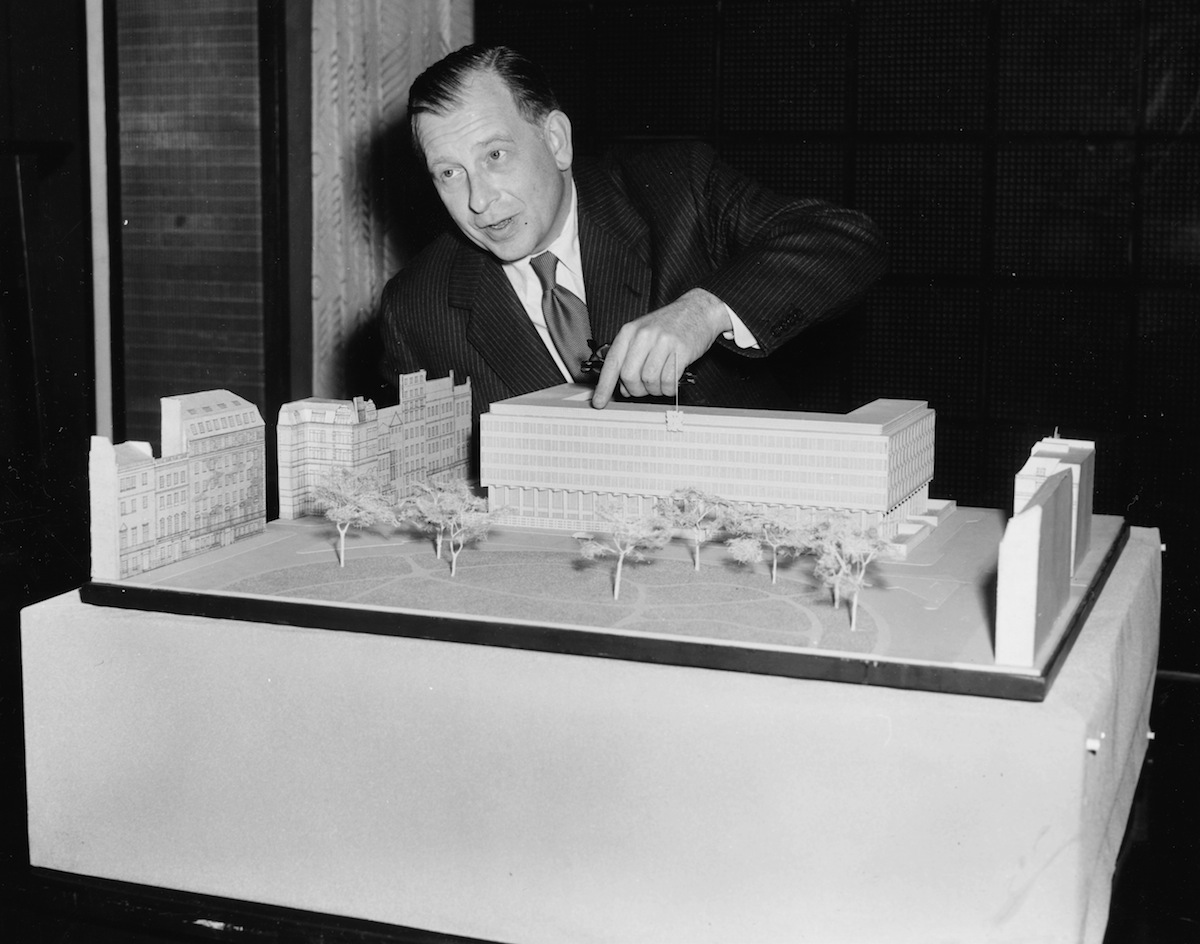 Architect Eero Saarinen with the model of the new proposed US Embassy in London, June 5, 1956. (Ron Case—Getty Images)