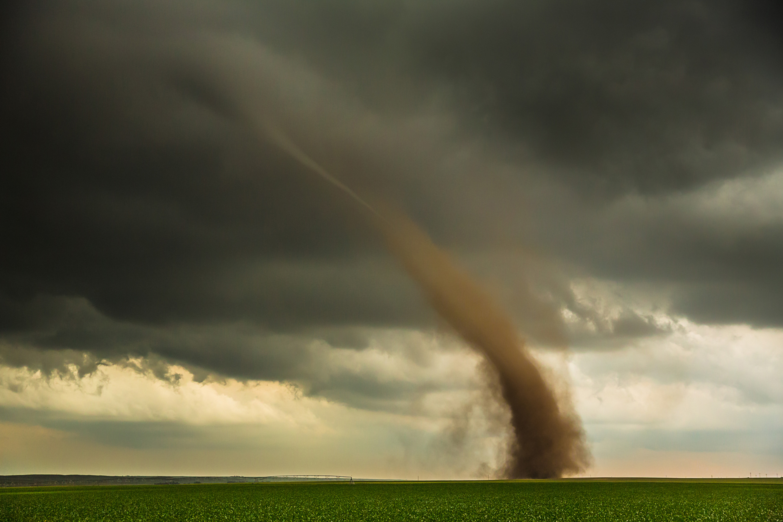 Tornado spinning up red topsoil near Dix, Nebraska.