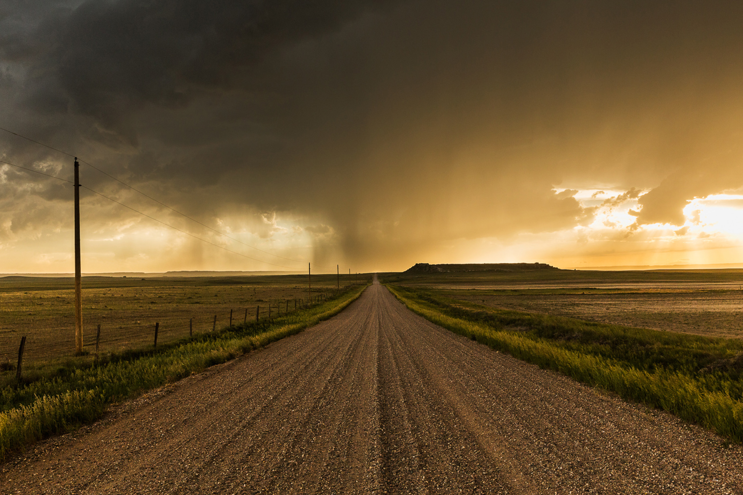 Precipitation descends from the base of a supercell near Wheatland, Wyoming.