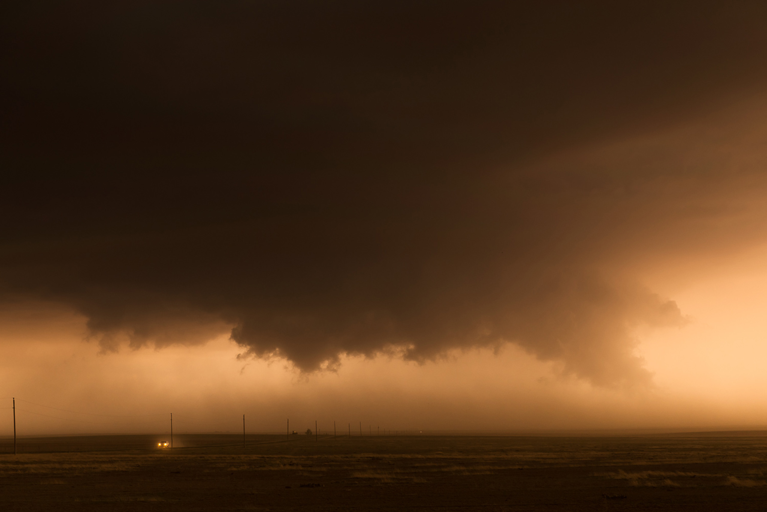 Car caught in a dust-filled wall cloud, near Haswell, Colorado.
