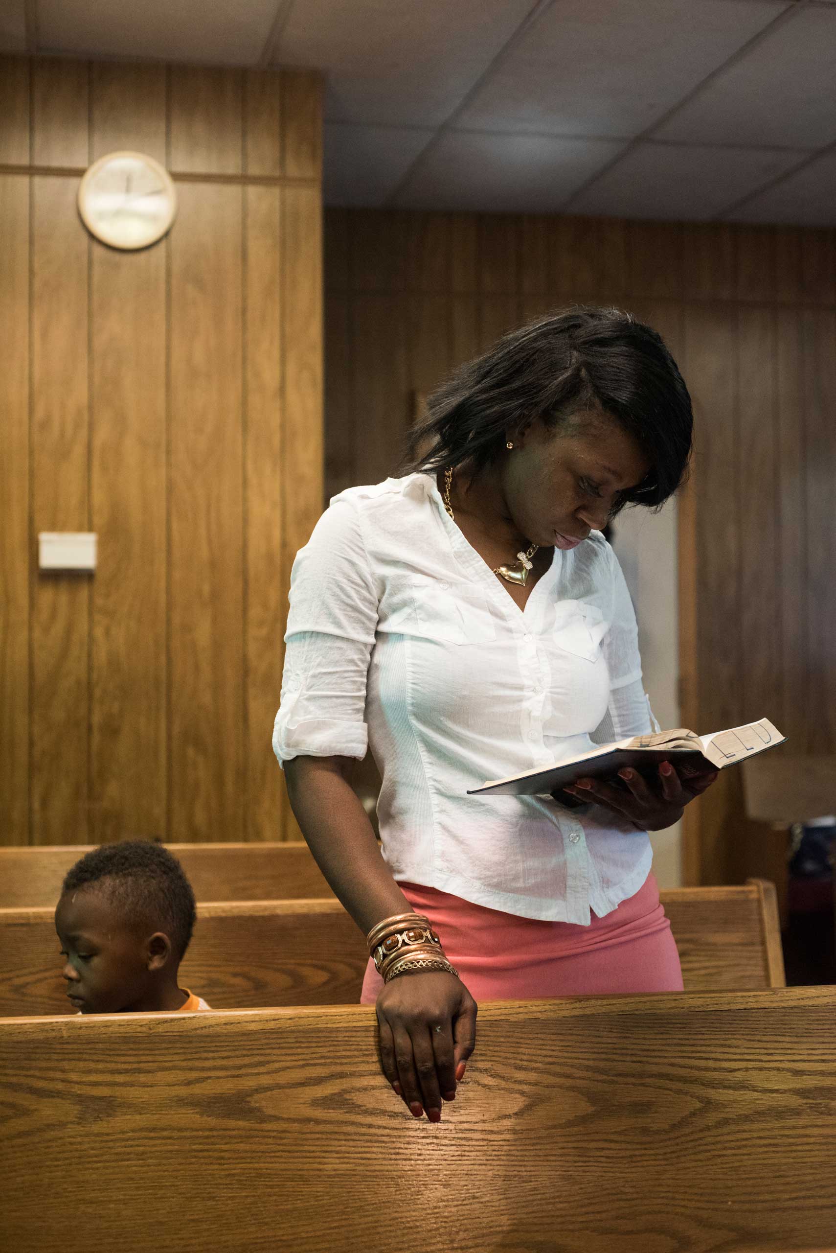 Latonya Williams and her son Carlos Williams attend worship at the Christ Love Divine Missionary Baptist Church in Ferguson, Mo.