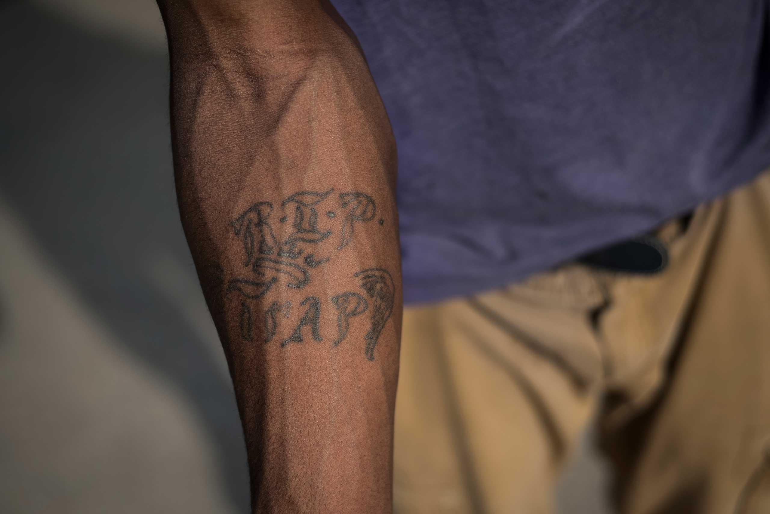 Raymon  Trip  Williams shows his tattoo dedicated to his best friend Demetrius  Trap  Stegall, who was shot and killed in Ferguson, Mo. in 2009.