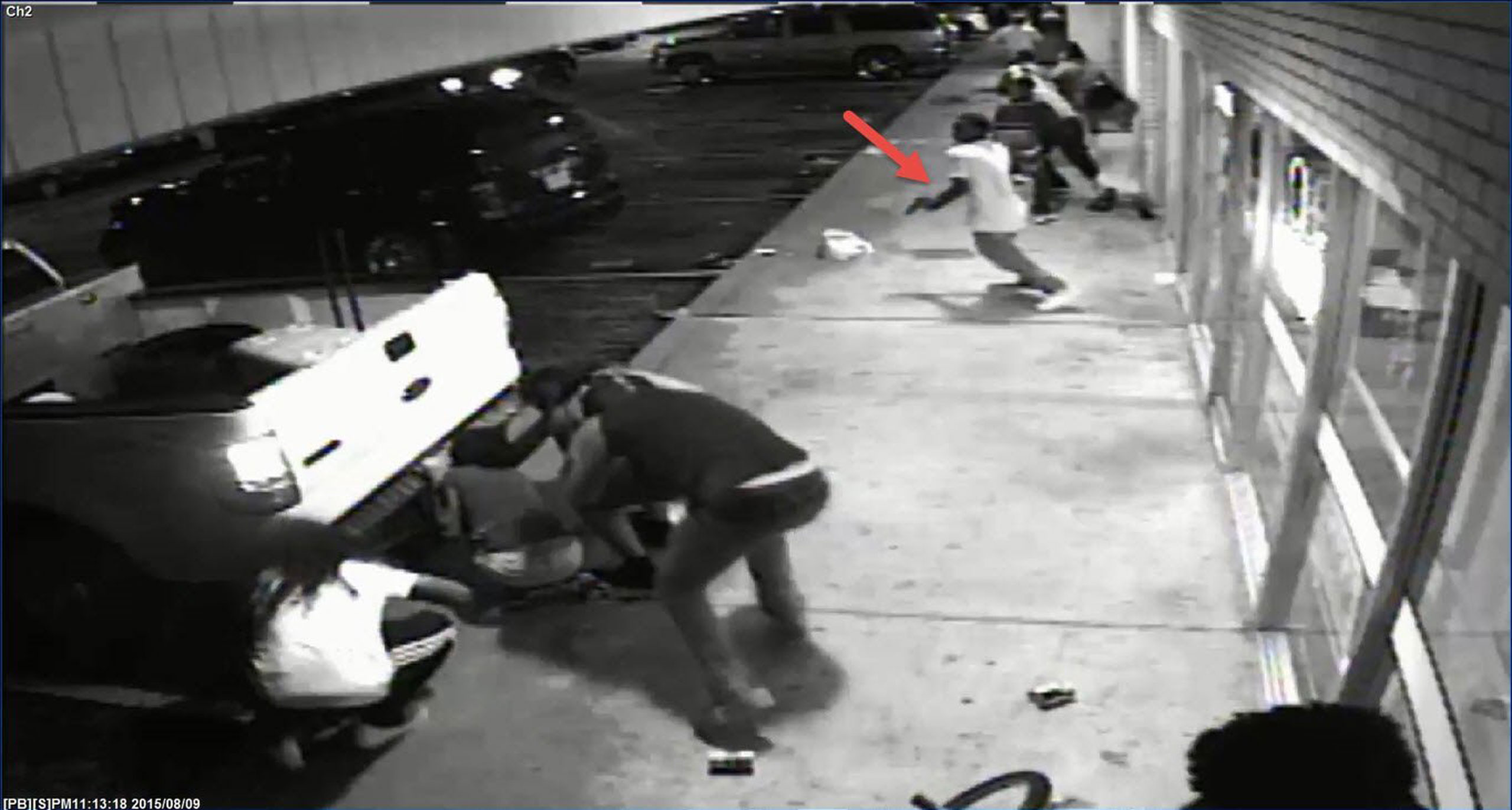 ST. LOUIS, MO - AUGUST 09: In this handout provided by the St. Louis County Police Department, video surveillance taken from Solo Insurance Services, appears to show Tyrone Harris Jr. grab a handgun out of his waistband once shots are fired during the protest in the W. Florissant corridor, prior to the officer involved shooting on August 9, 2015 in St. Louis, Missouri. Tyrone Harris Jr., was shot and wounded by detectives during protests one year after the death of Michael Brown (Photo by St. Louis County Police Department via Getty Images)