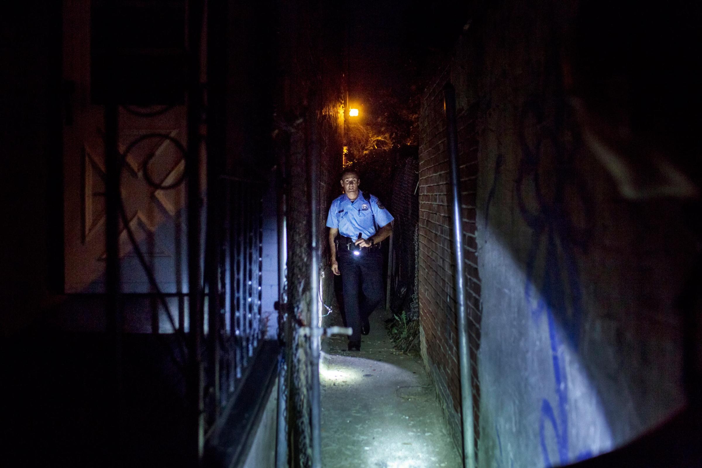 July 31st, 2015. Philadelphia.  Officer , Richard O'Brien searches an alley where a suspect had fled previously, searching for evidence he might have dropped items like drugs or weapons. He found nothing.