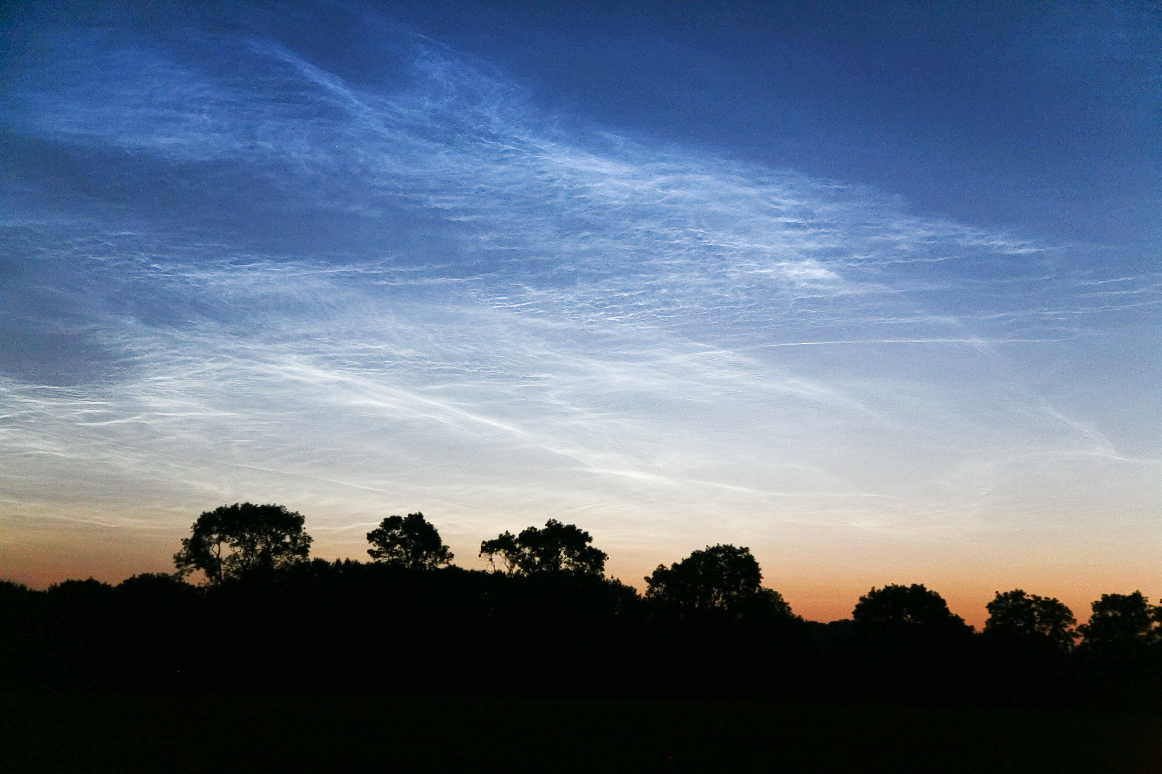 Photographs of noctilucent clouds appearing in the night sky over Britain on July, 2009.