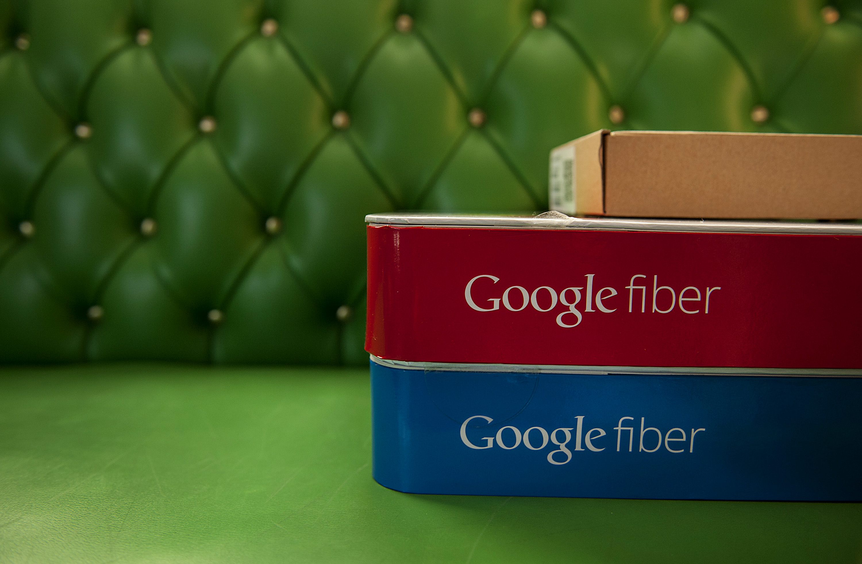 Boxes of equipment needed to install Google Fiber broadband network sit on a couch at the home of customer Becki Sherwood in Kansas City, Kansas, U.S., on Tuesday, Nov. 27, 2012. (Bloomberg&mdash;Bloomberg via Getty Images)