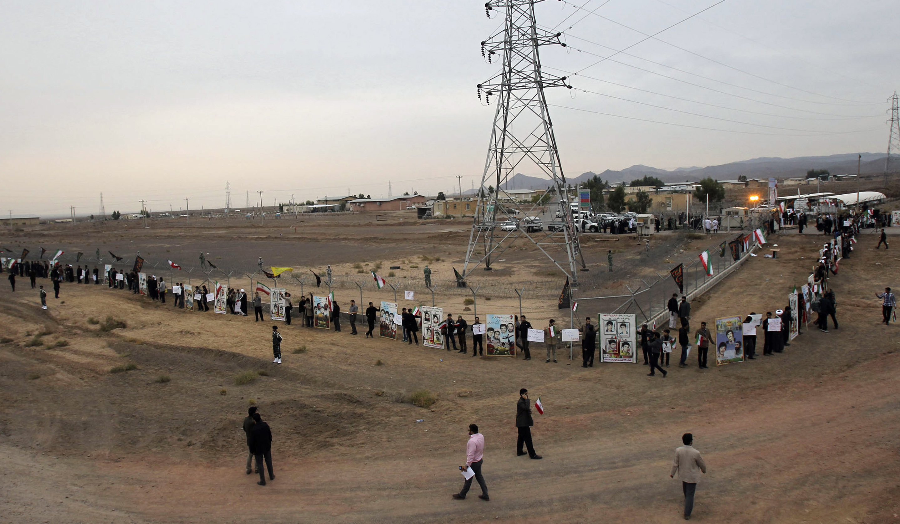 Iranian students formed a human chain to defend their country's nuclear program in 2013 outside the Fordow Uranium Conversion Facility in the northern part of the country. (CHAVOSH HOMAVANDI / AFP / Getty Images)