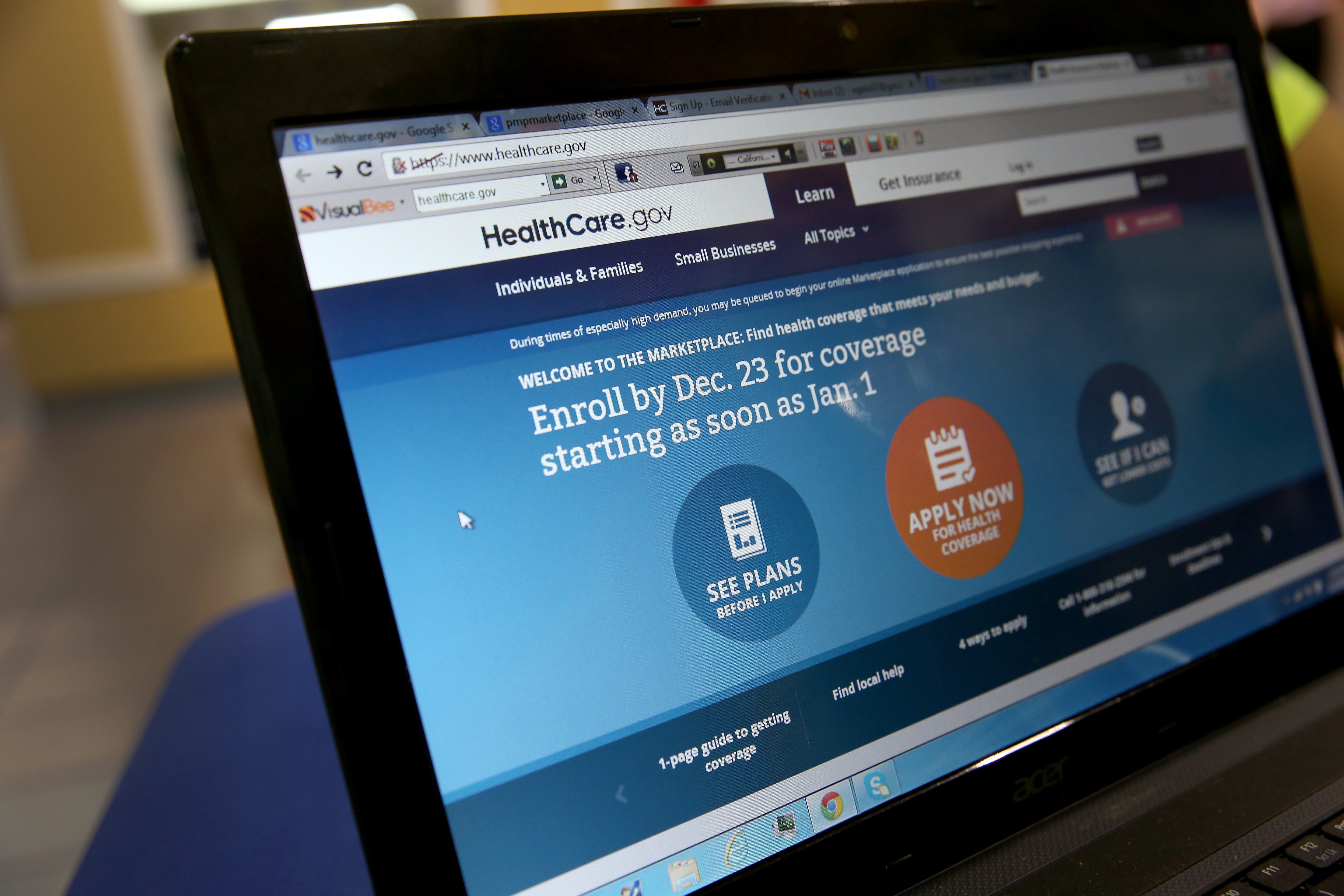 A computer screen reads, "Enroll by Dec. 23 for coverage starting as soon as Jan 1." as agents from Sunshine Life and Health Advisors help people purchase health insurance under the Affordable Care Act at the kiosk setup at the Mall of Americas on December 22, 2013 in Miami, Florida. (Joe Raedle&mdash;Getty Images)
