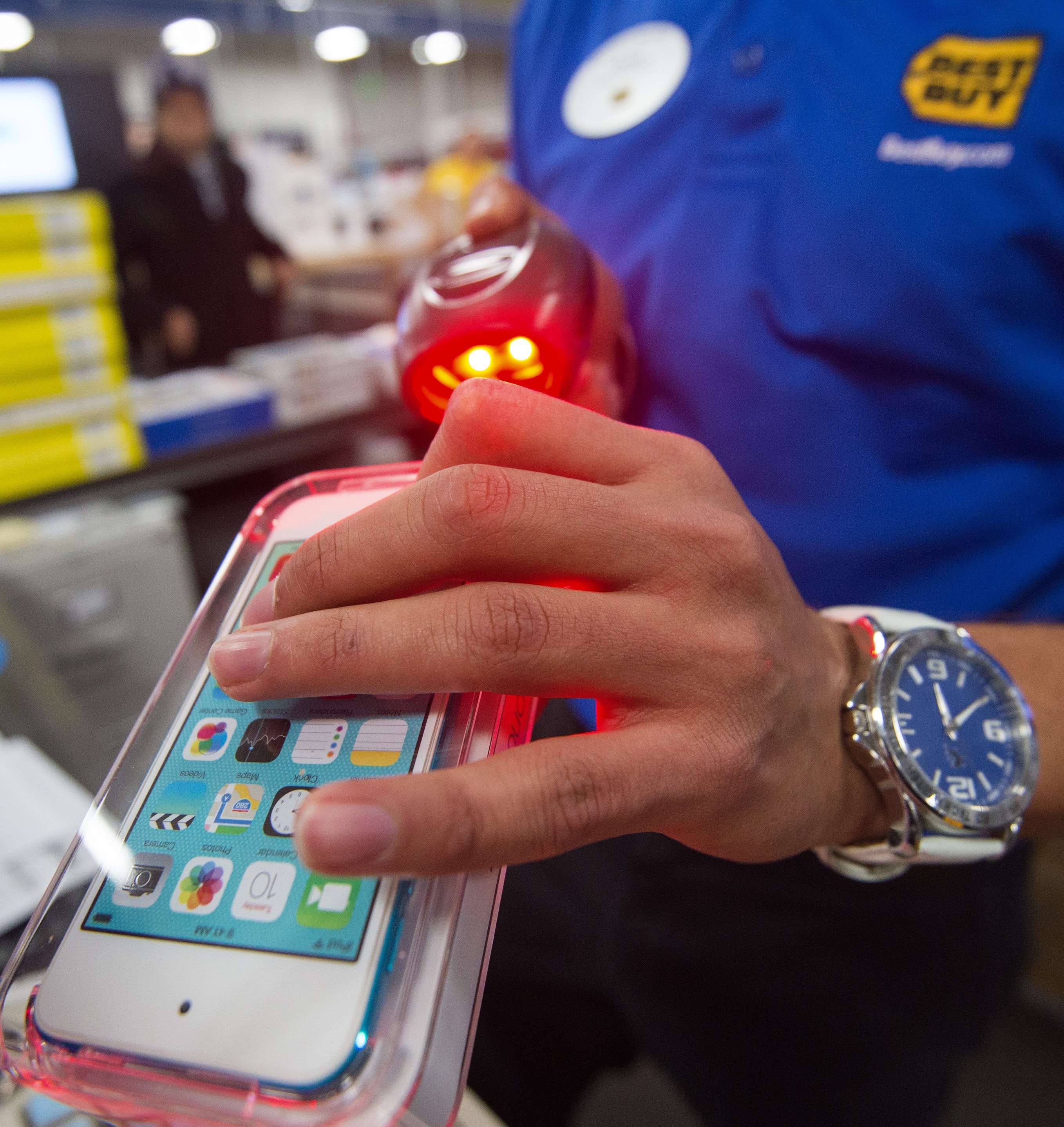 A salesperson scans an iPod Touch at the Best Buy store in Fairfax, Virginia on Nov. 27, 2014. (Paul J. Richards—AFP/Getty Images)