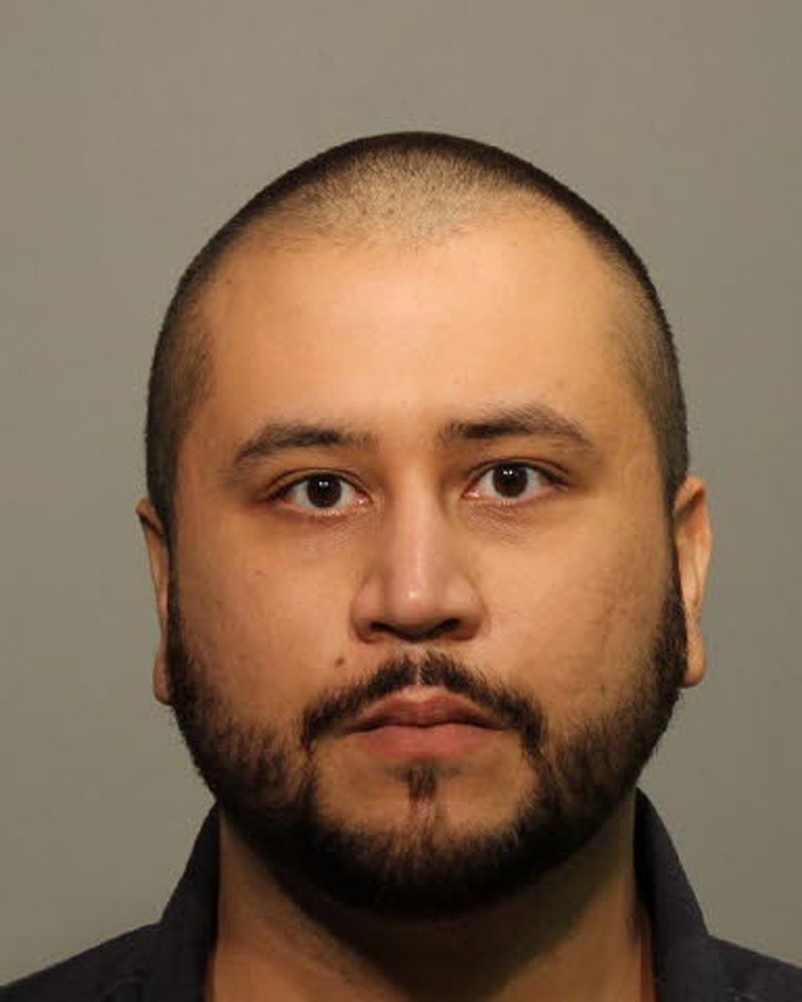 George Zimmerman poses for a mug shot photo after being arrested and booked into jail at the John Polk Correctional Facility in Sanford, Fla. on January 9, 2015. (Getty Images)