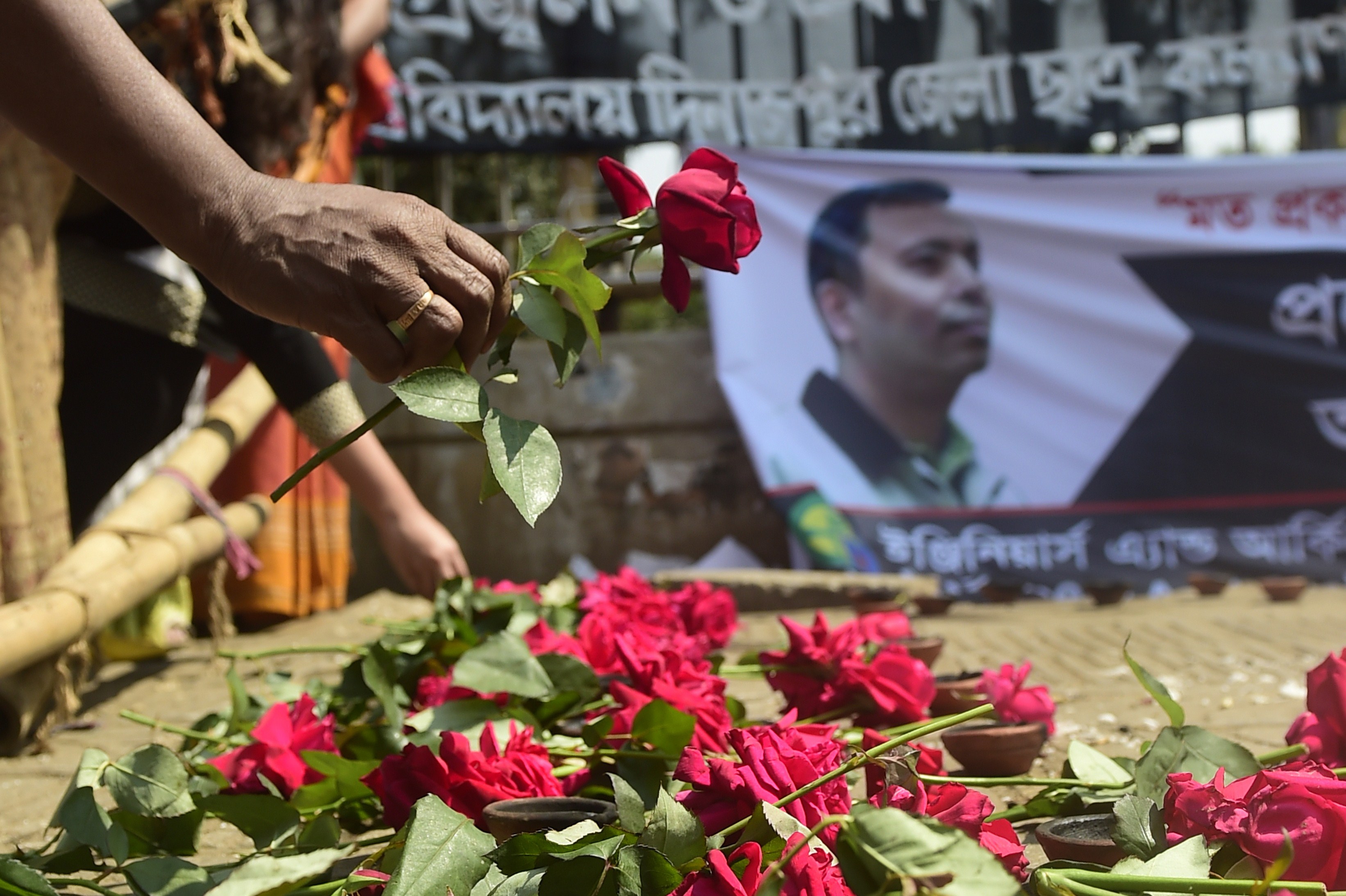 A Bangladeshi social activist pays his  last respects to slain US blogger of Bangladeshi origin and founder of the Mukto-Mona (Free-mind) blog site, Avijit Roy in Dhaka on March 6, 2015 after he was hacked to death by unidentified assailants in the Bangladeshi capital on February 26. (MUNIR UZ ZAMAN—AFP/Getty Images)