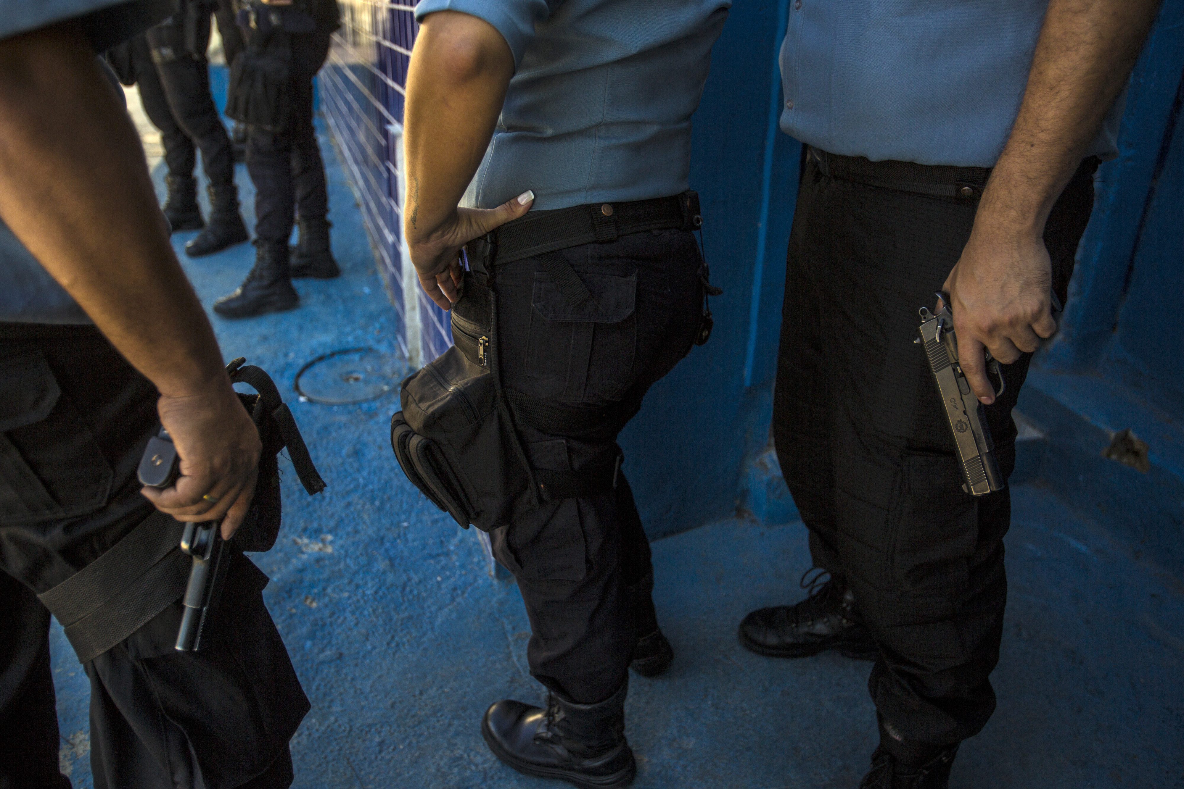 Armed officers from the Pacifying Police Unit (UPP) patrol in the Providencia favela of Rio de Janeiro, Brazil, on Monday, June 22, 2015. (Bloomberg—Bloomberg via Getty Images)