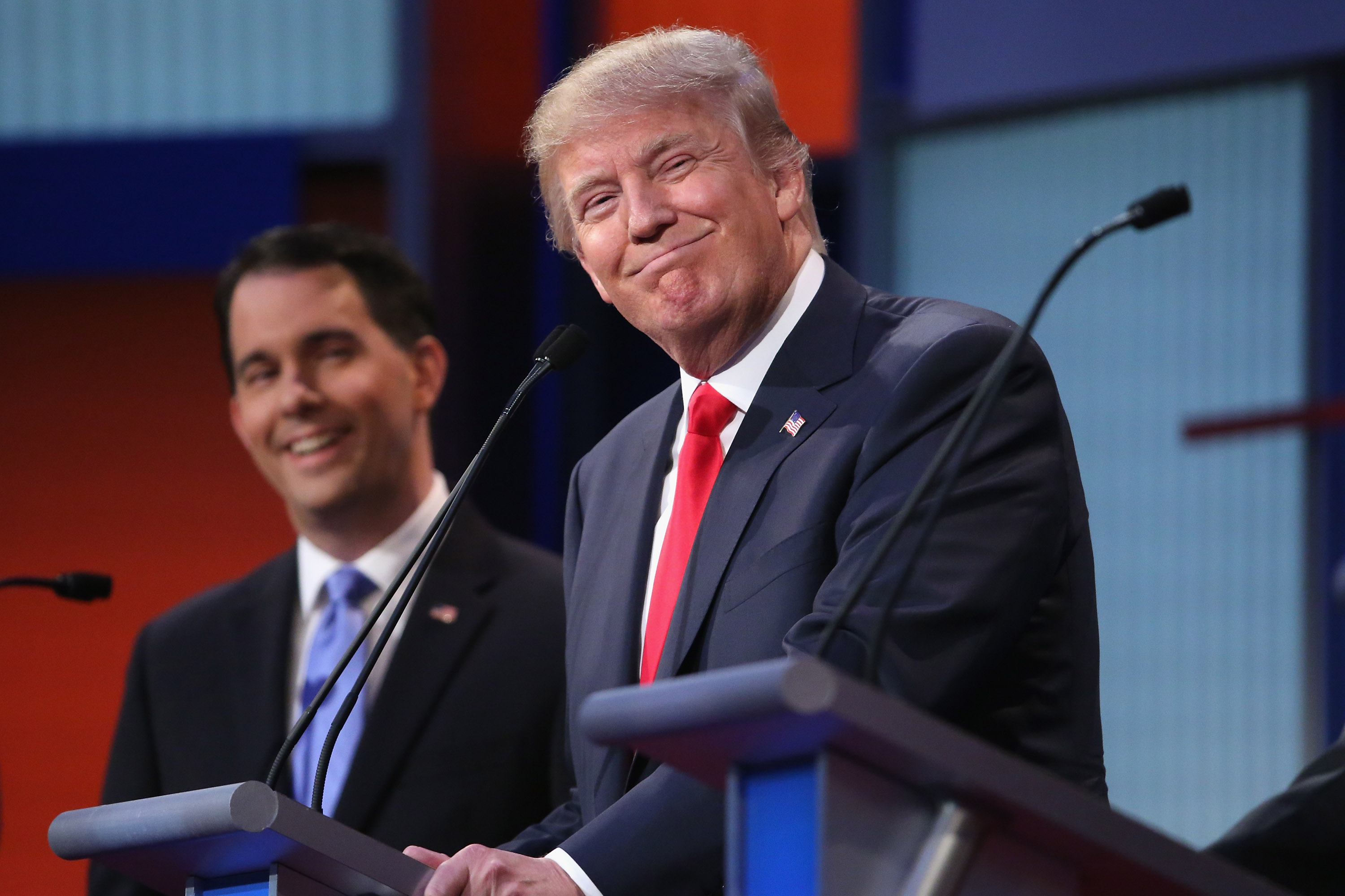 Republican presidential candidates Donald Trump (R) and Wisconsin Gov. Scott Walker participate in the first prime-time presidential debate hosted by FOX News and Facebook at the Quicken Loans Arena August 6, 2015 in Cleveland, Ohio. (Chip Somodevilla—Getty Images)