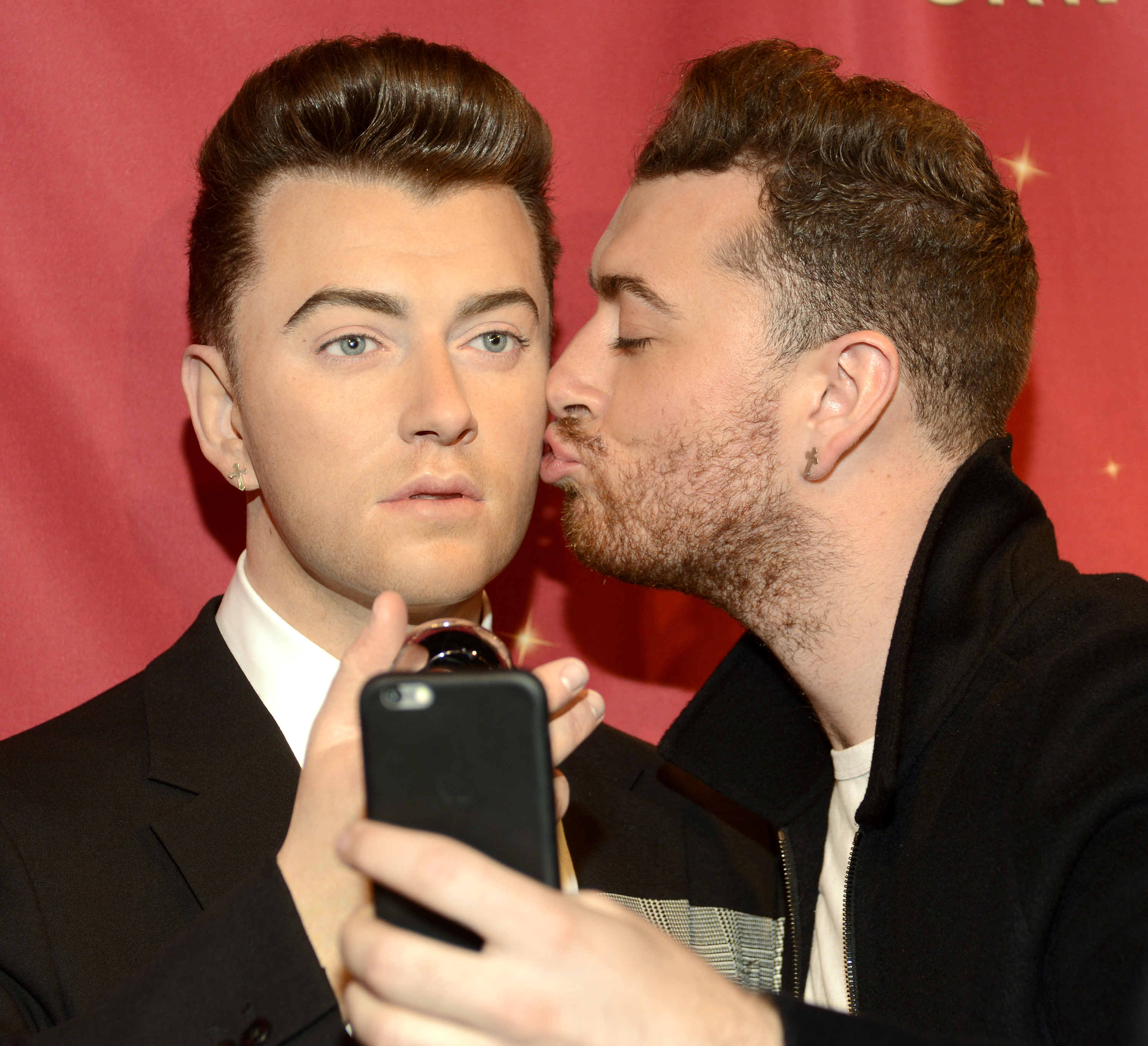 Sam Smith with is wax figurine at Madame Tussauds San Francisco on Aug.10, 2015 in San Francisco. (Tim Mosenfelder&mdash;Getty Images)
