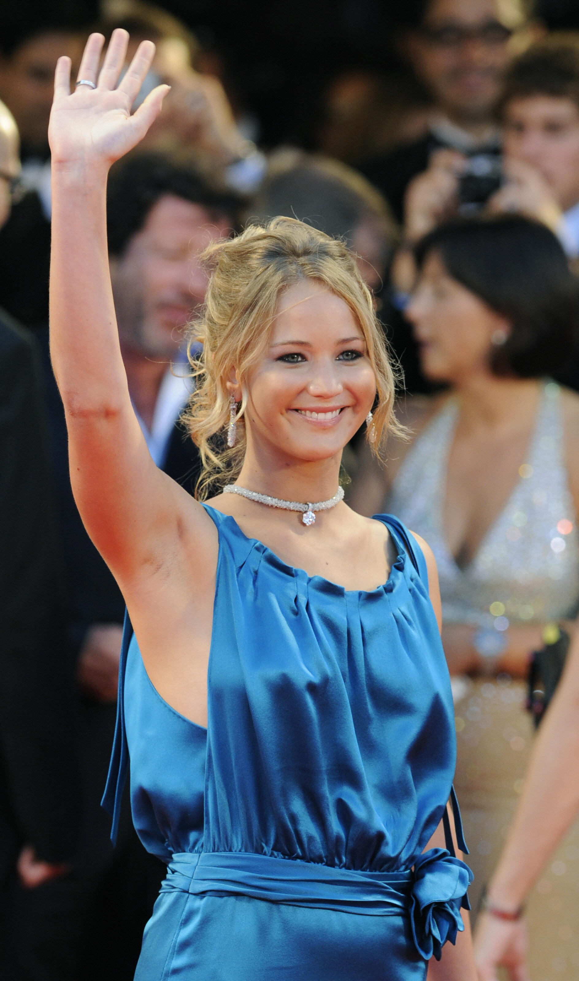 US actress  Jennifer Lawrence waves to p