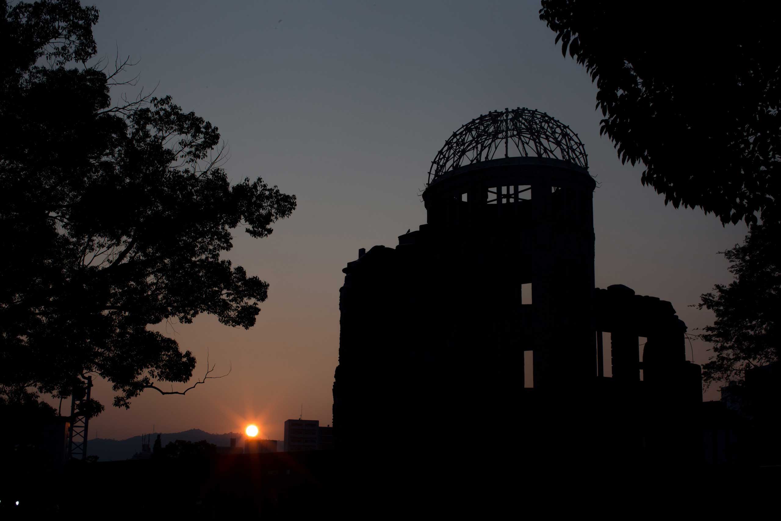 The Atomic Bomb Dome is seen at sunset in the Hiroshima Peace Memorial Park, on Aug. 5, 2015.