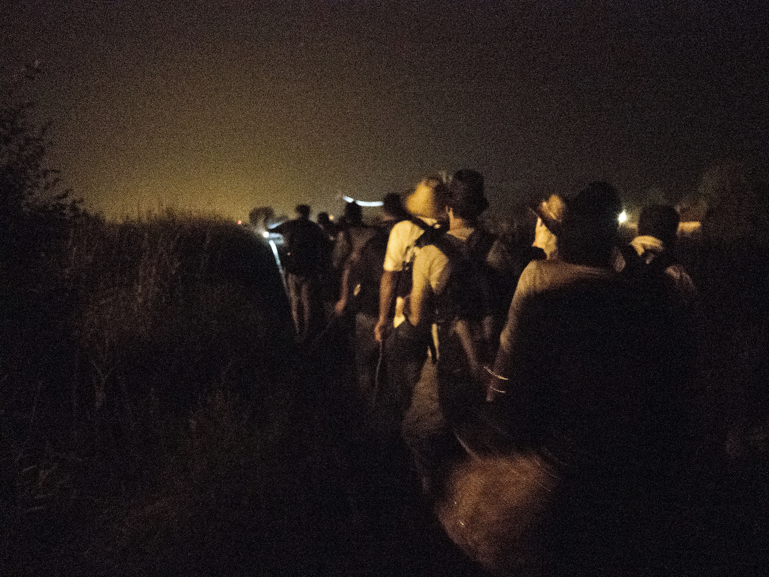 Horgos, Serbia. August 12, 2015. Syrian families wait for nightfall to walk toward the border to attempt to cross it.