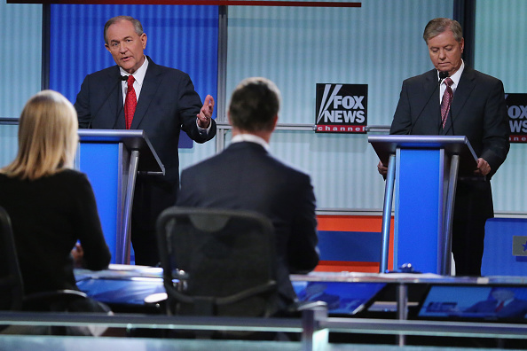 Former Gov. Jim Gilmore (left) at the Fox News debate in Cleveland