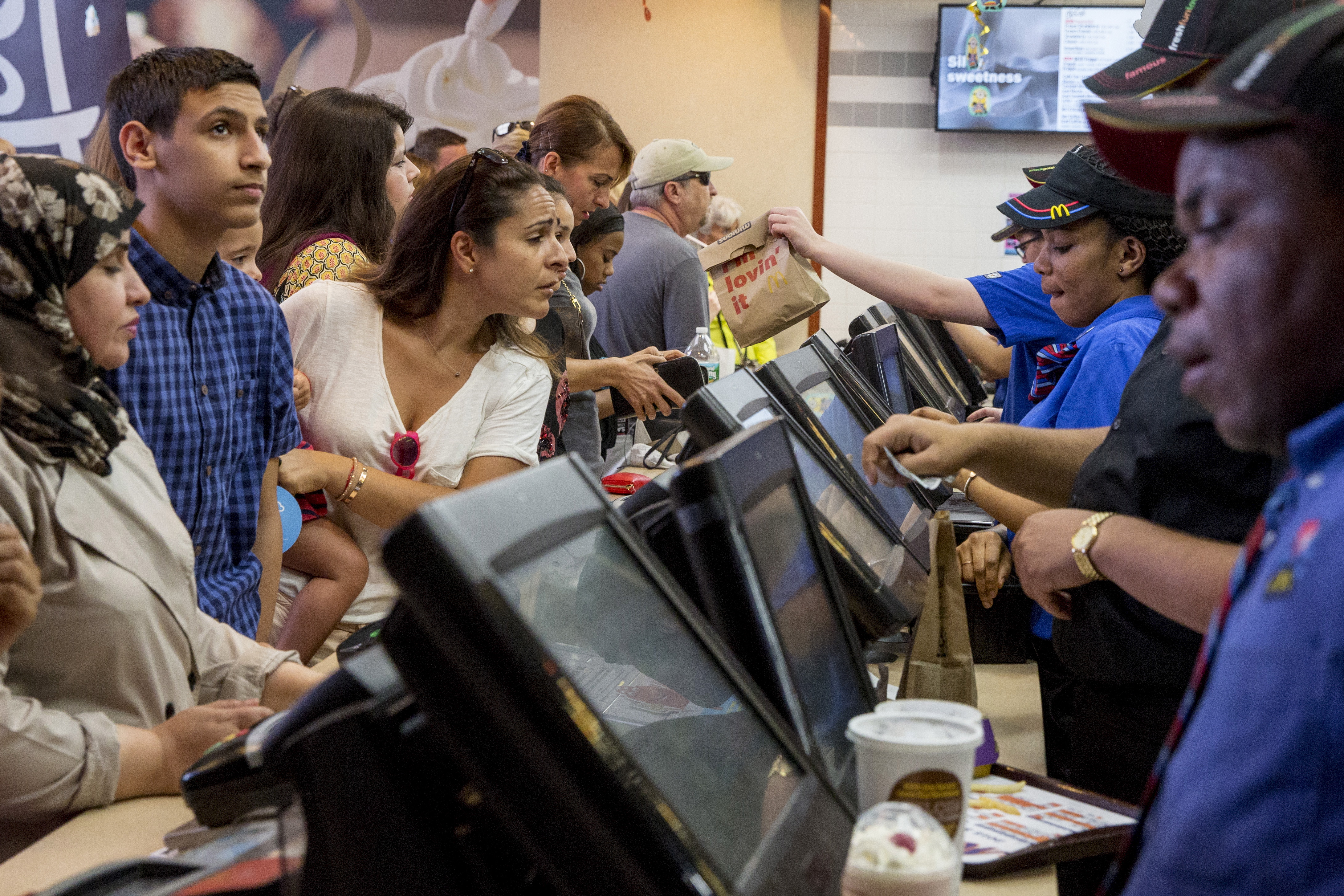 Customers are served at a McDonald's in Times Square in New York on July 23, 2015.